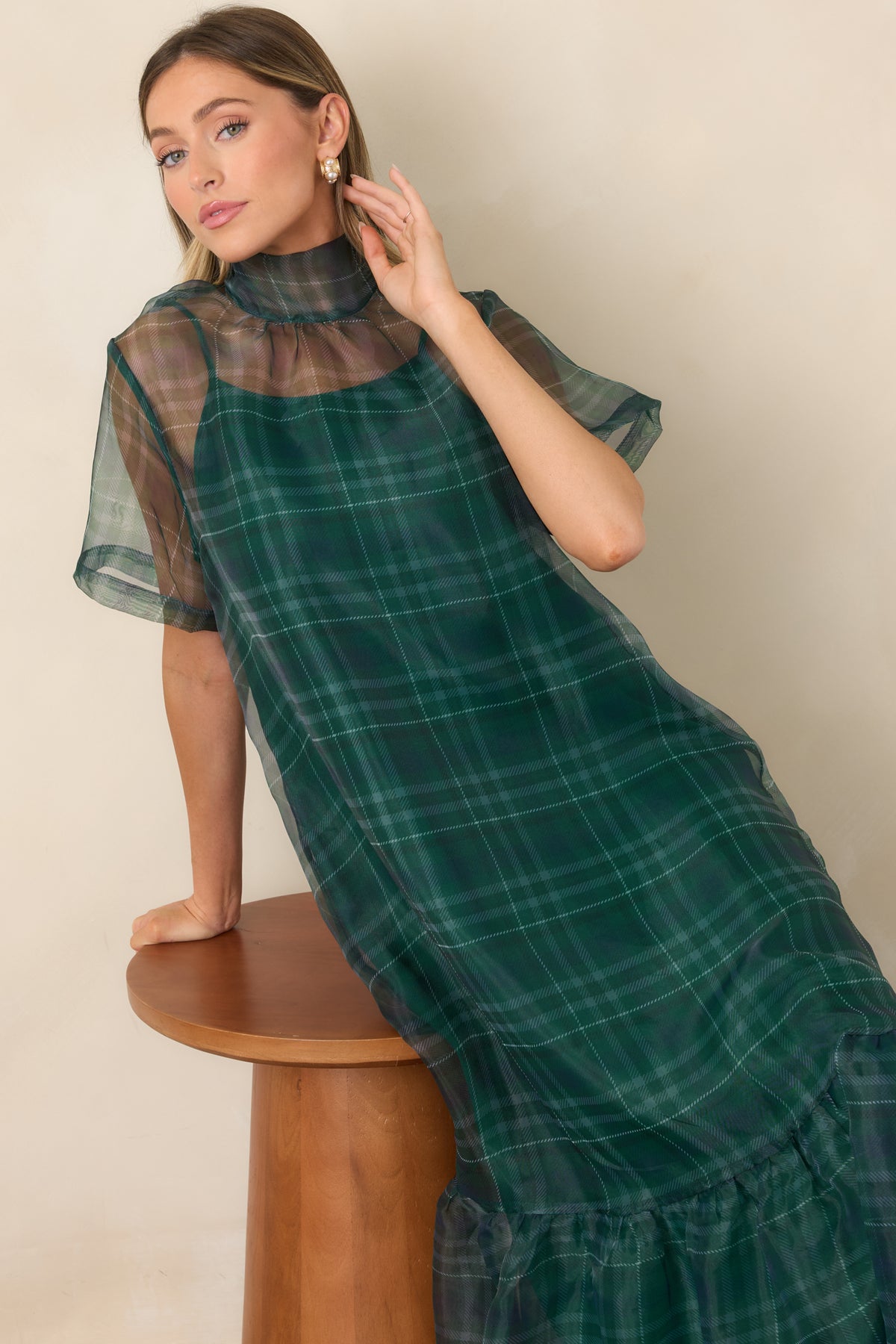 Sheer emerald dress with subtle plaid dimension, relaxed shaping, and a flowing floor-length silhouette.