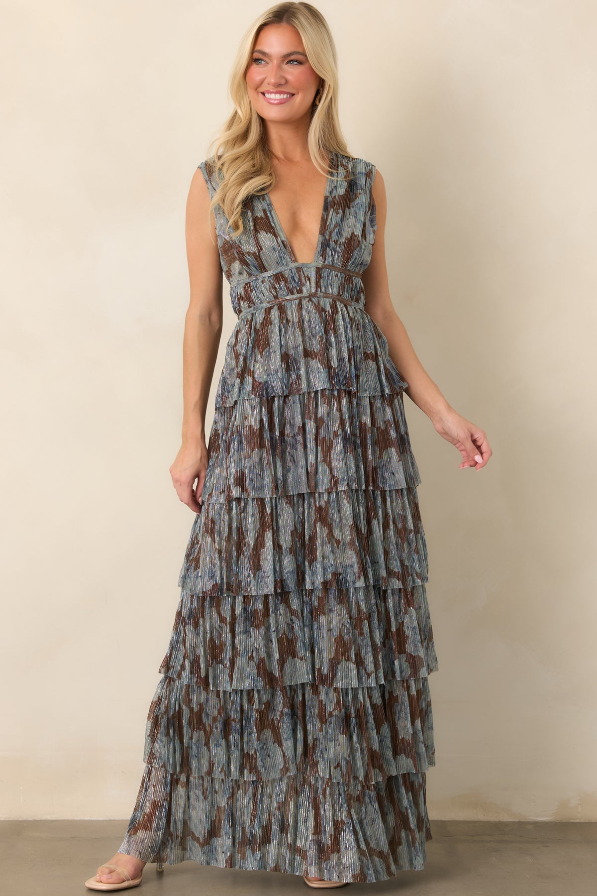 Shimmering steel blue and chocolate floral maxi dress with an empire waist and softly cascading skirt.