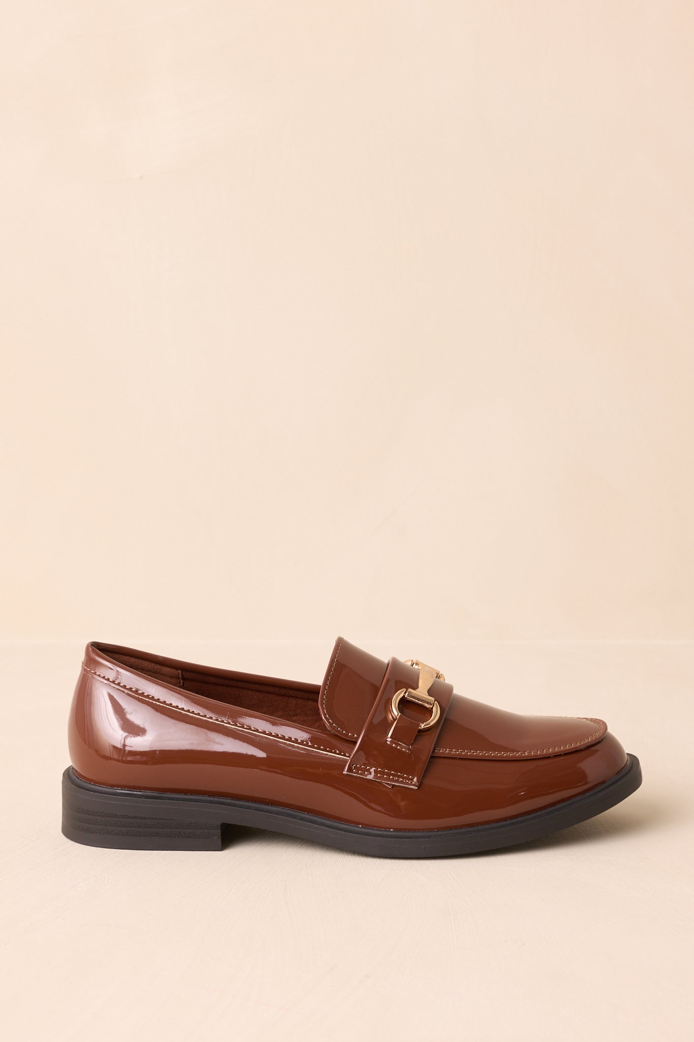 Side profile view highlighting the low black stacked heel.