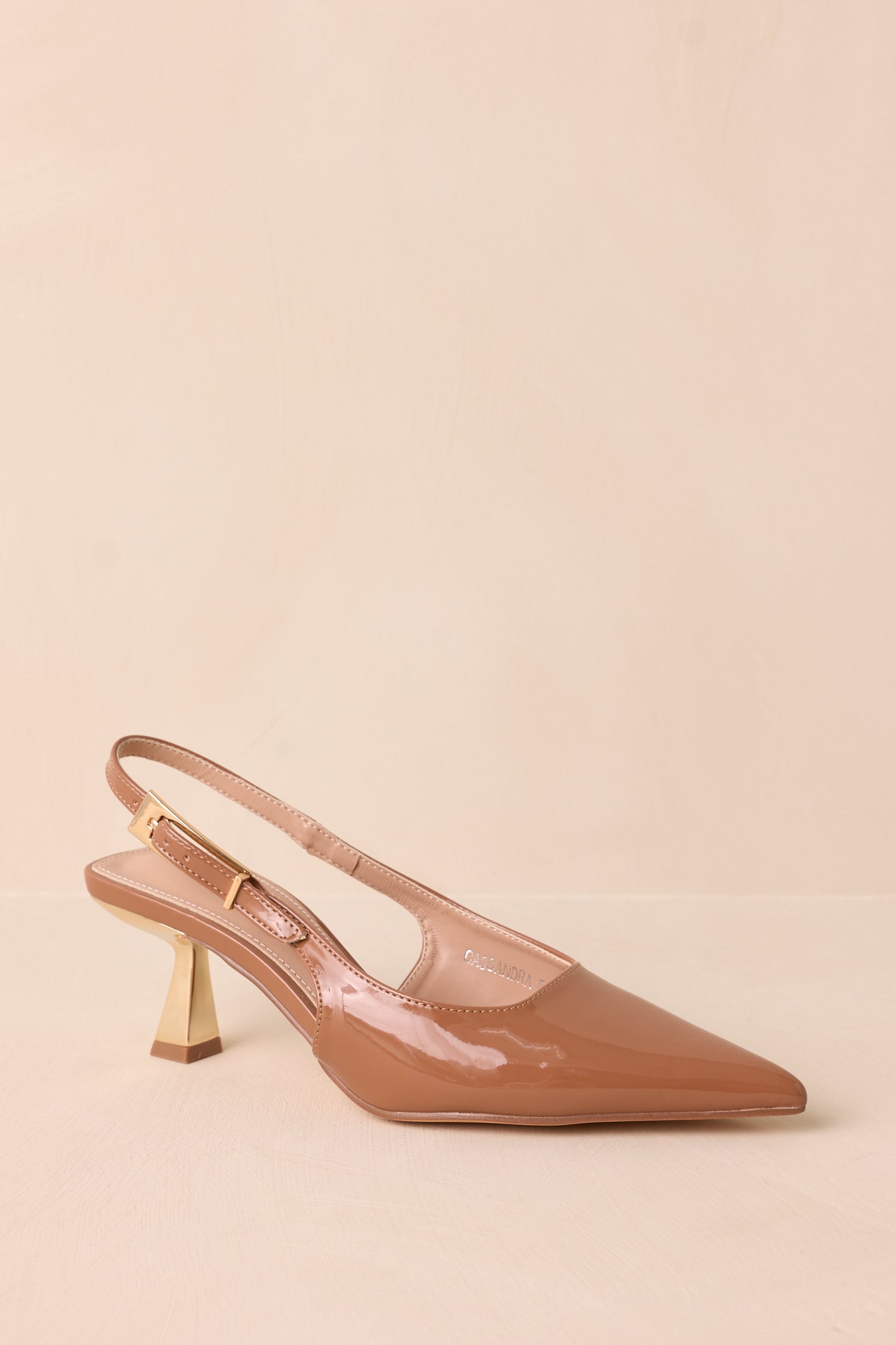 Cropped side view of the heels highlighting the adjustable slingback strap and sleek silhouette.