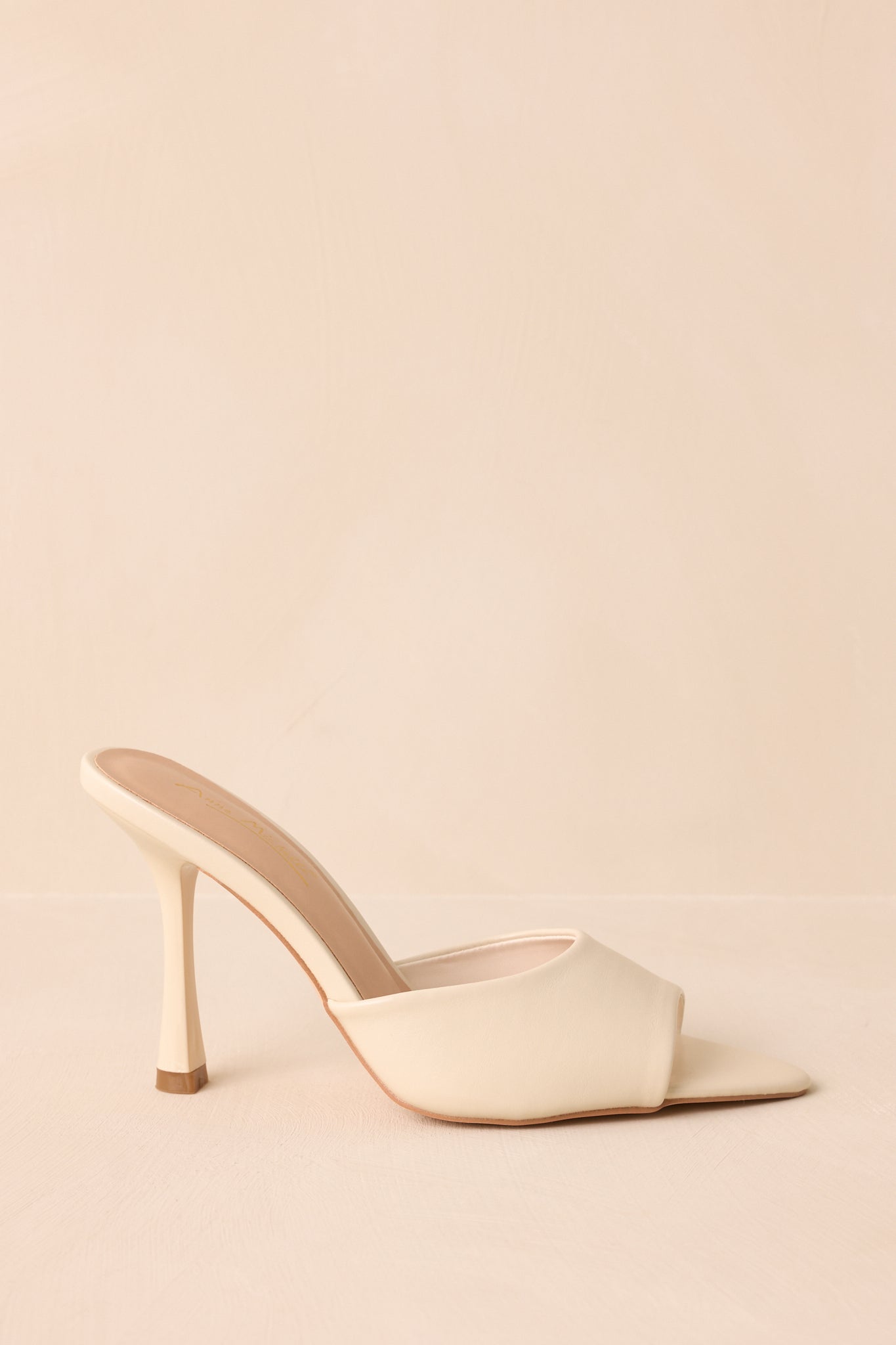 Side cropped view highlighting the stiletto heel and sleek mule silhouette.