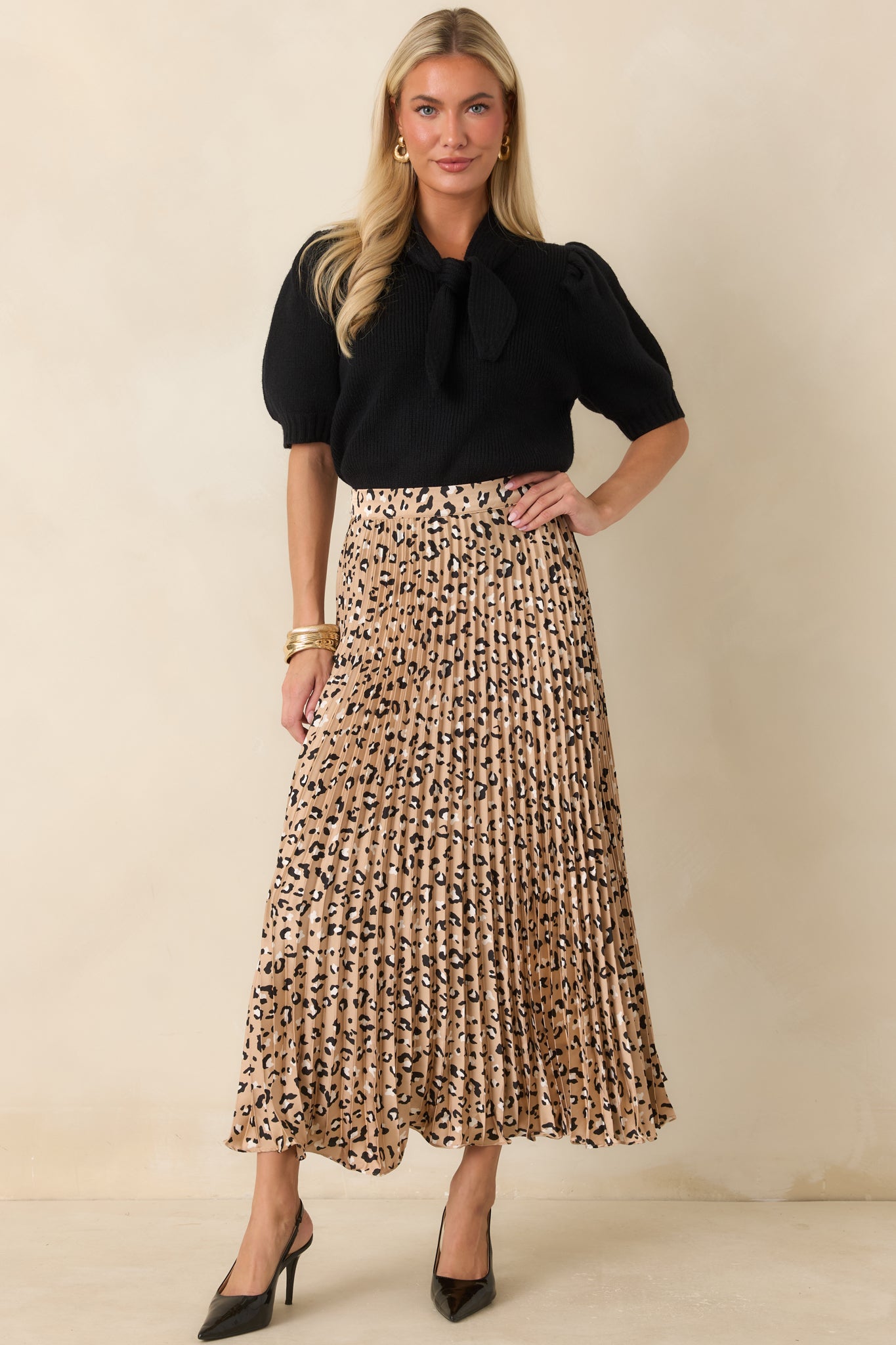 Silky satin skirt featuring a flattering elastic waistband, lightweight movement, and a timeless leopard print design.
