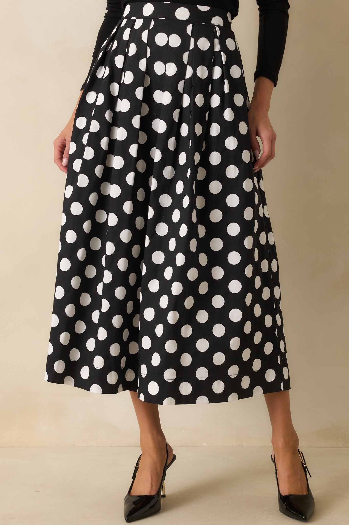 Cropped view emphasizing the skirt’s pleated texture and lightweight fabric.