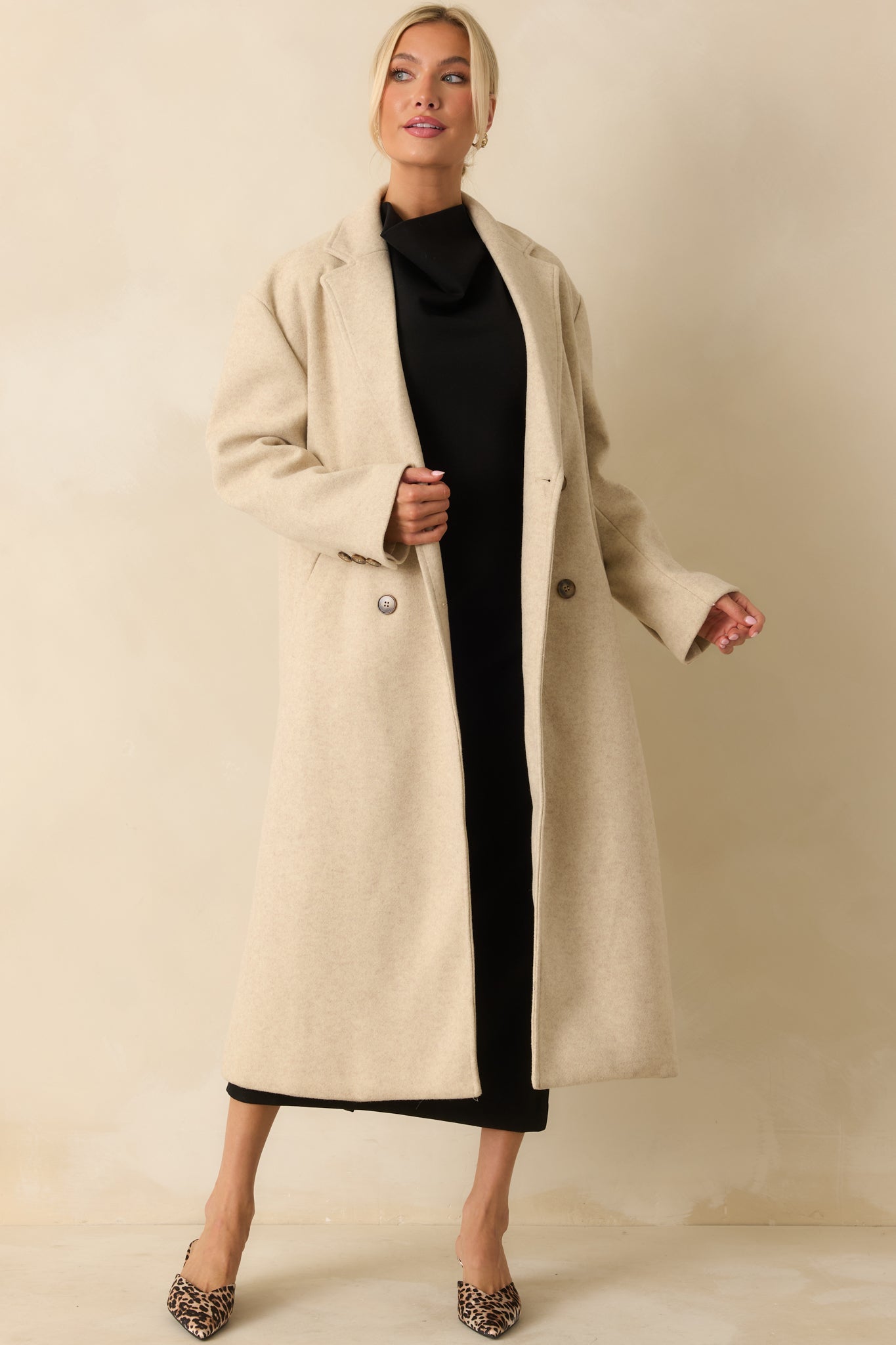 Sleek black midi dress featuring a chic high neckline and smooth, premium ponte fabric with 4-way stretch for a sculpted look