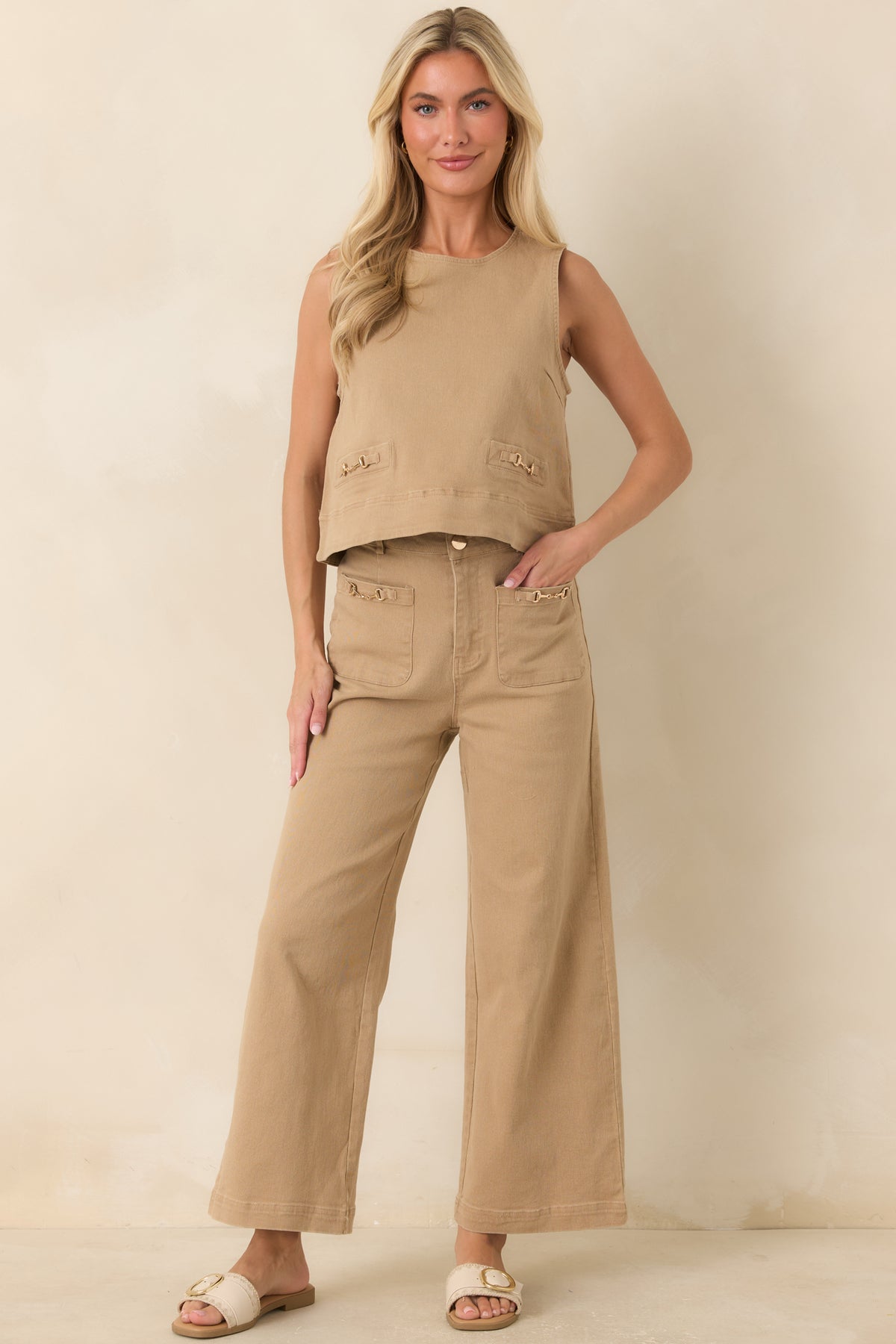 Sleeveless cotton-blend denim top featuring a round neckline, relaxed A-line silhouette, and polished gold-tone horsebit accents.