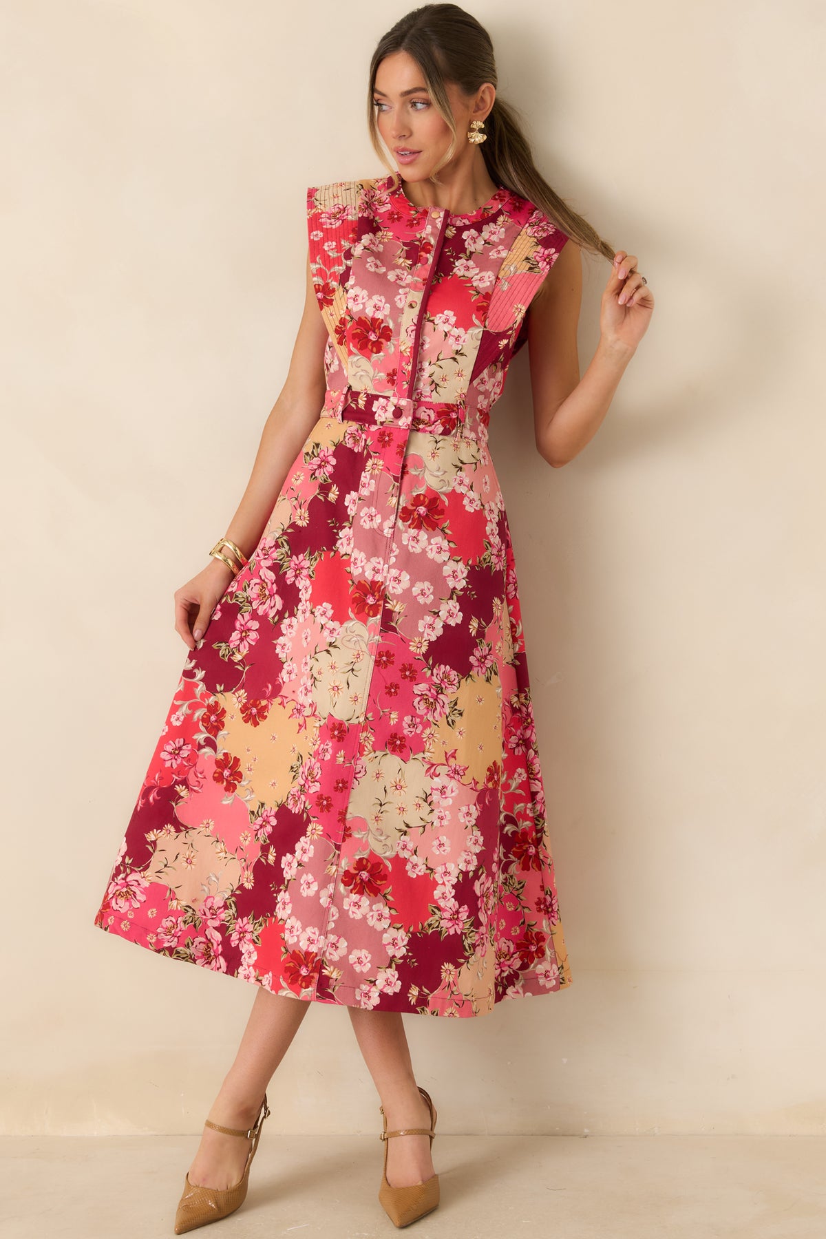 Sleeveless floral cotton denim dress with a tailored button-front bodice and an easy A-line midi skirt.