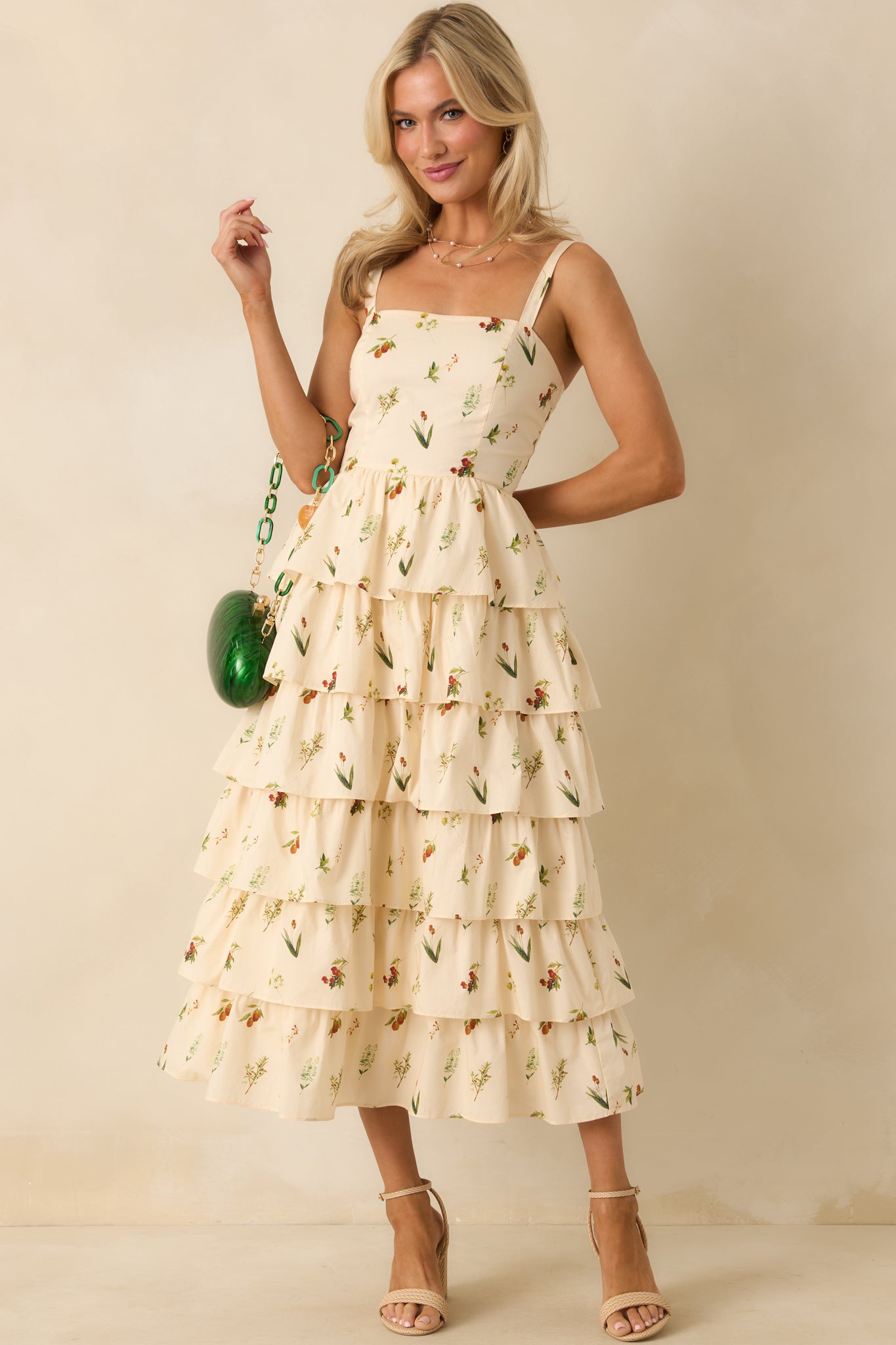 Sleeveless midi dress featuring elastic shoulder strap inserts and paneled bodice design.