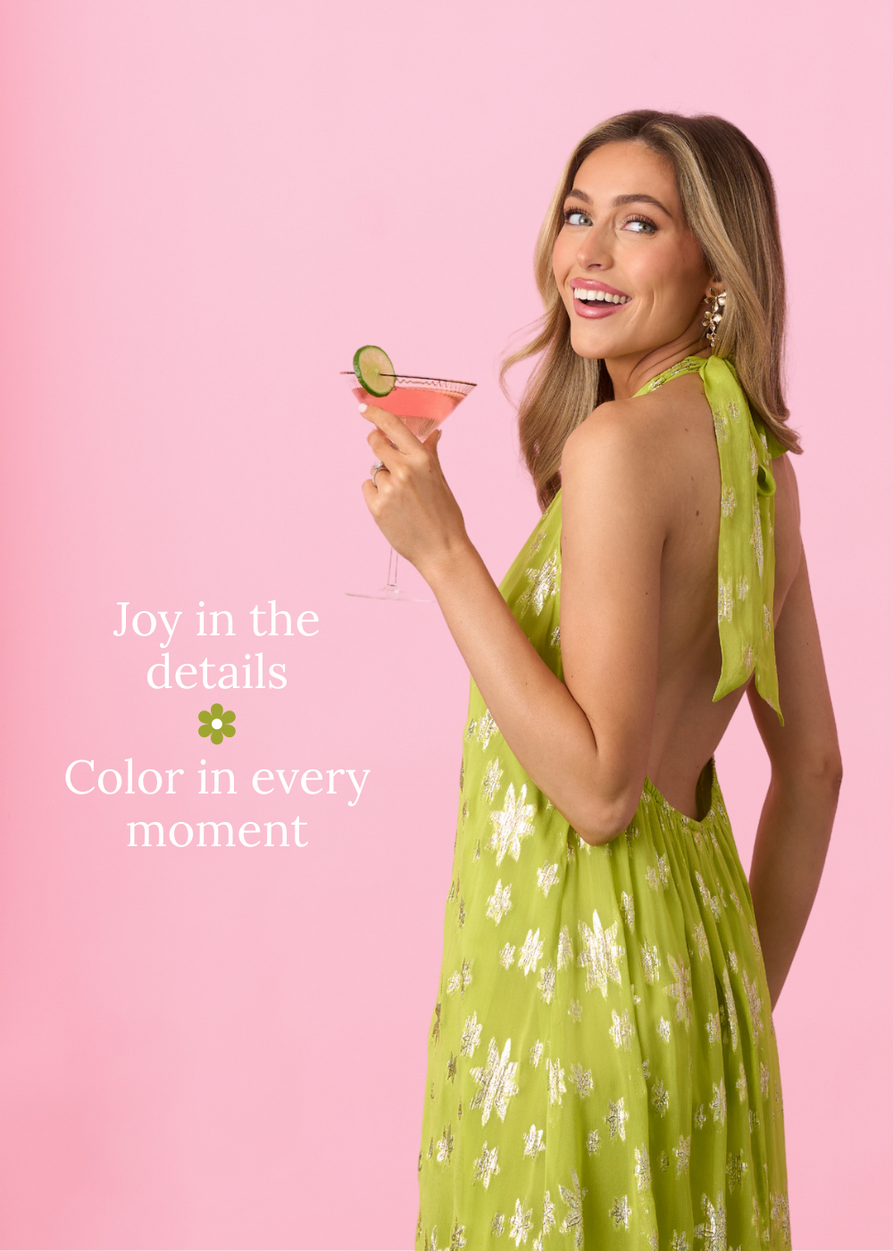 Woman in a green dress holding a cocktail with text on a pink background