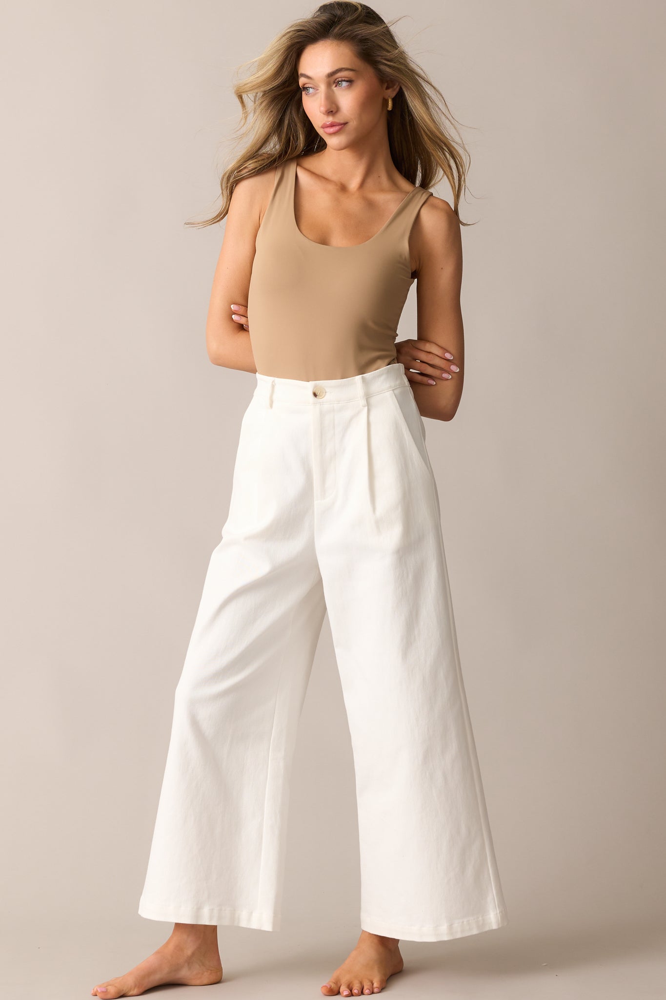 A slightly angled view of the bodysuit, emphasizing its minimalistic design and comfortable fit.