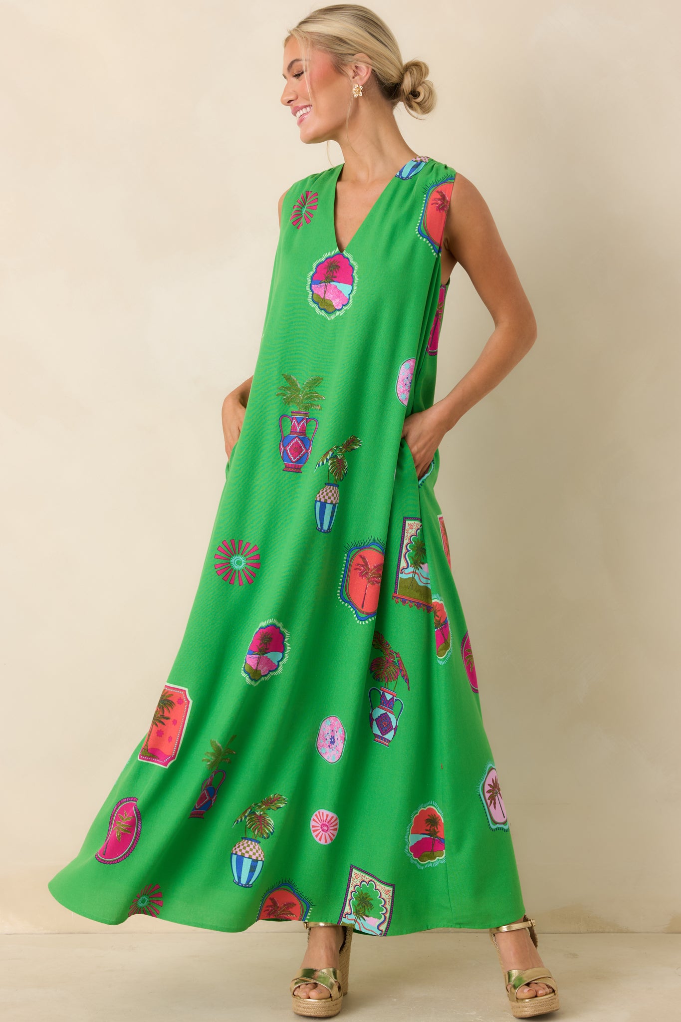 Slightly angled front view highlighting the vibrant multicolor tropical motifs and full-length drape.