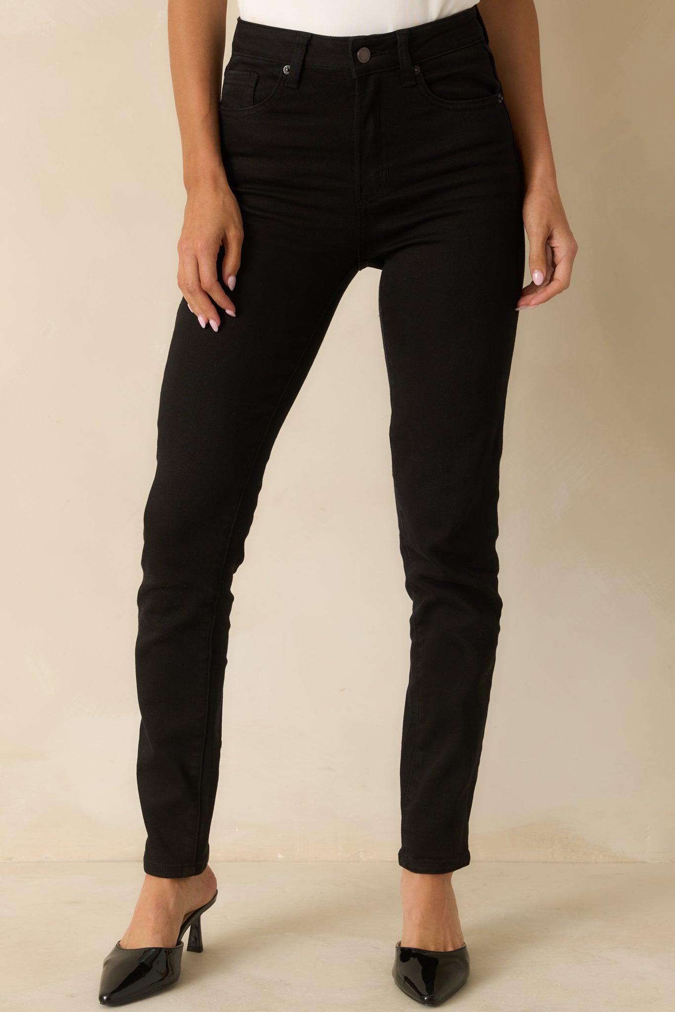 Close view of the jeans showing the slim fit and subtle structure in the design.