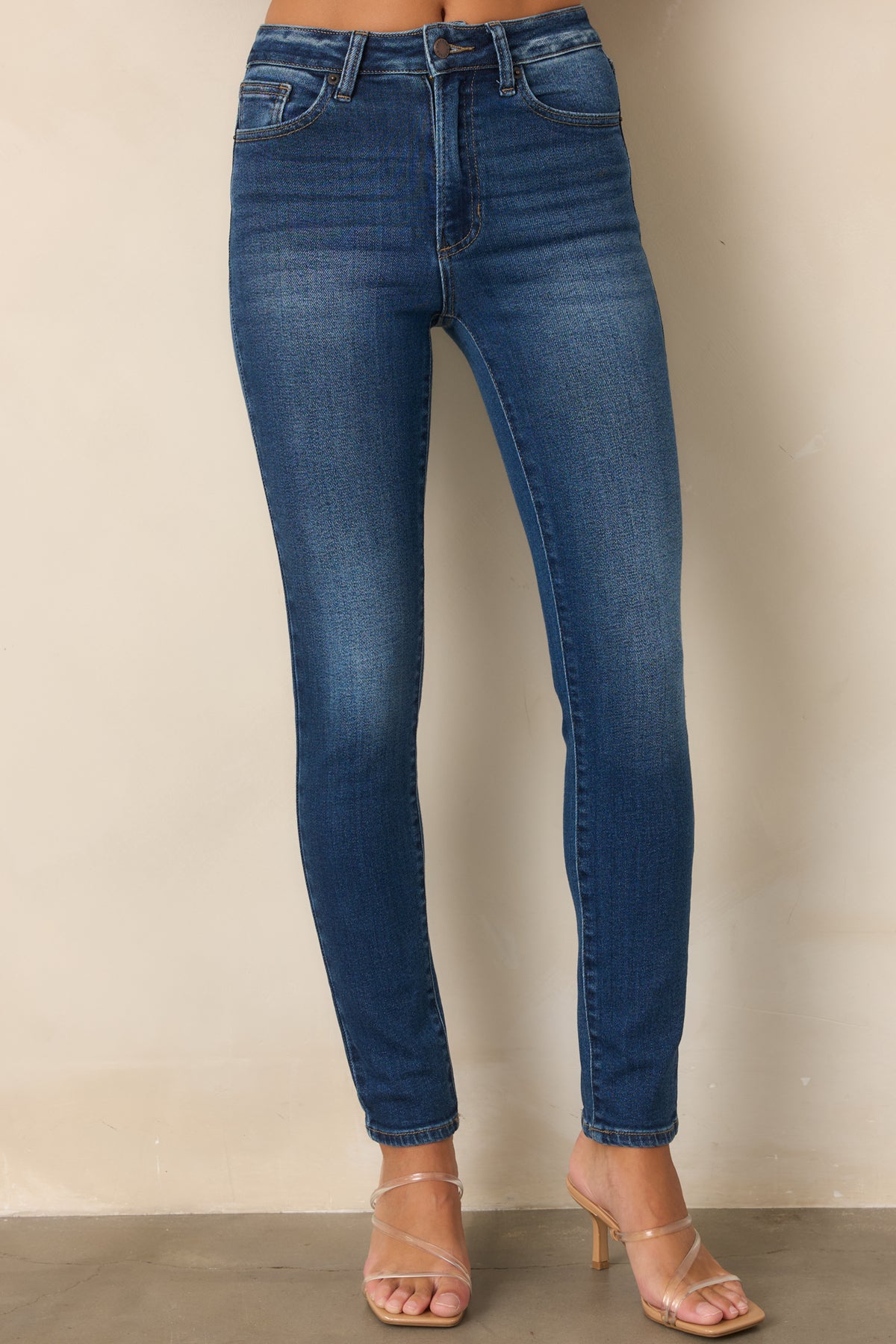 Slim-fit dark wash jeans with a polished finish and flexible stretch construction.