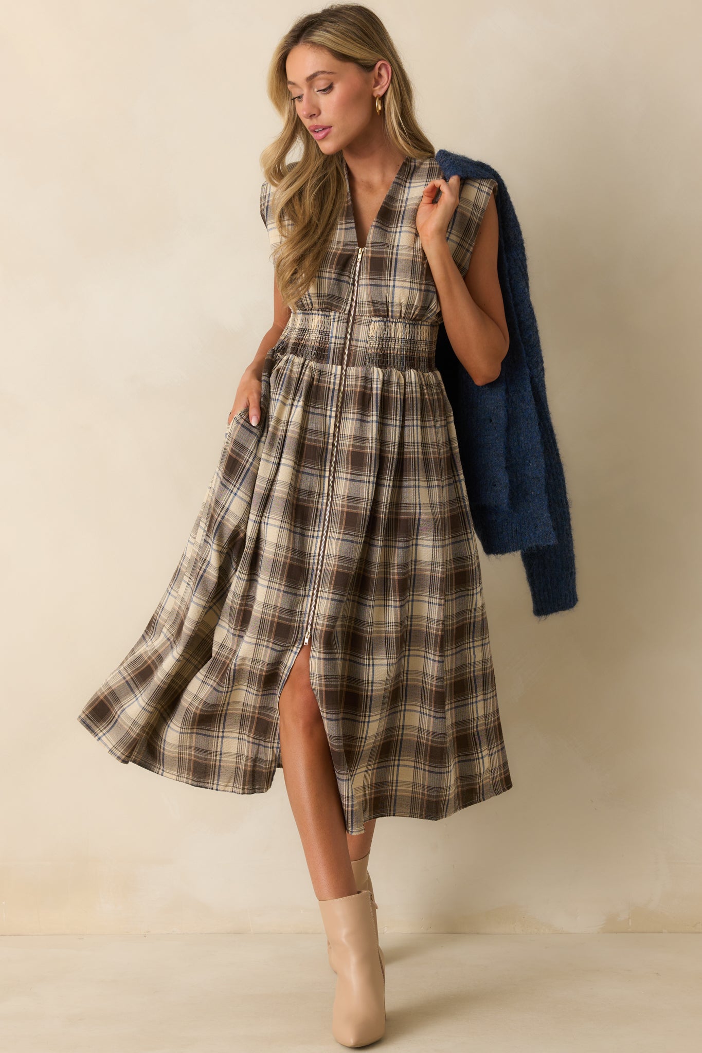 Smocked-waist plaid midi dress with a full-length zipper front and capped sleeve detailing.
