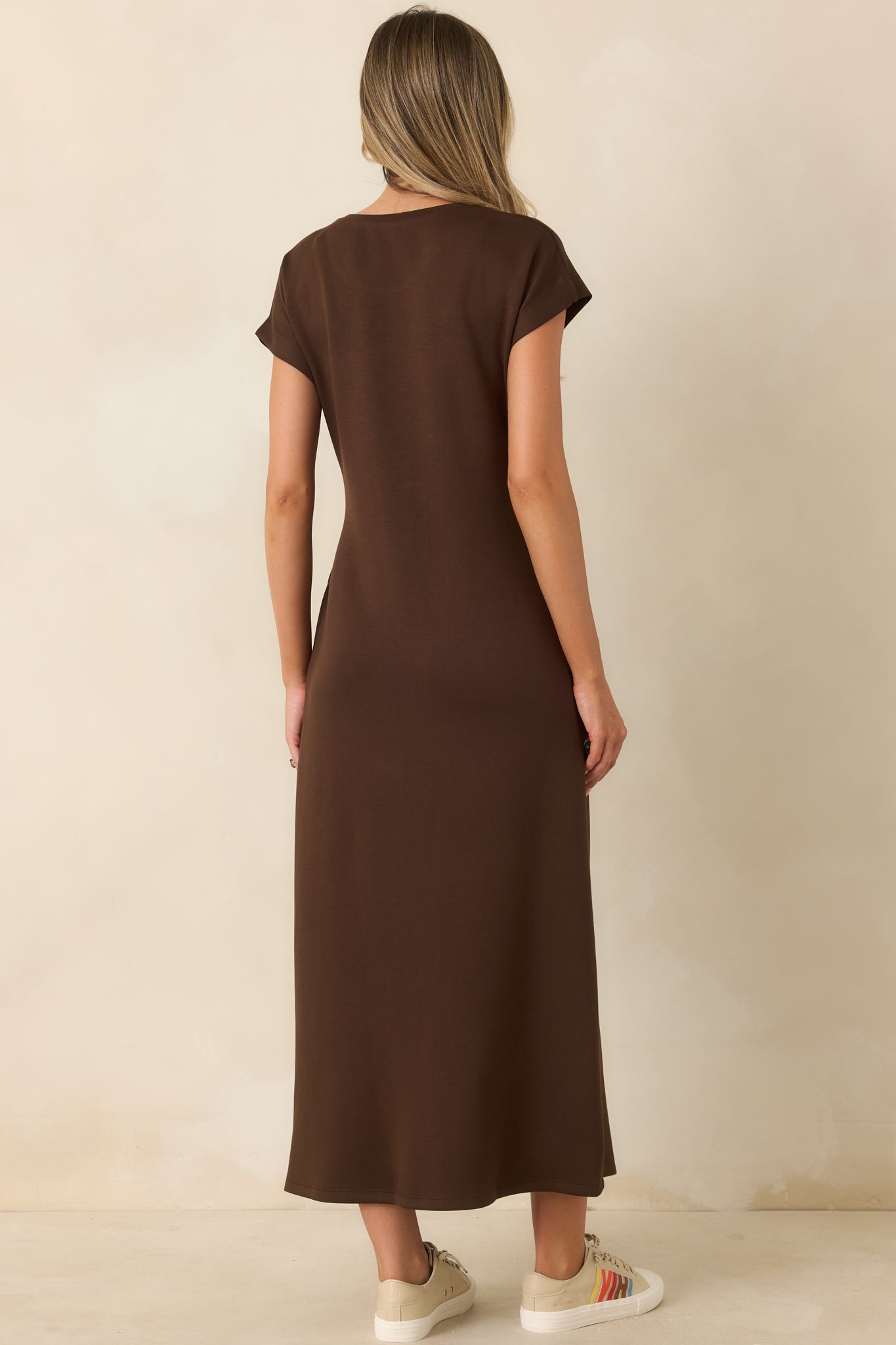 Rear view of the midi dress featuring a smooth draped silhouette and comfortable stretch fabric.