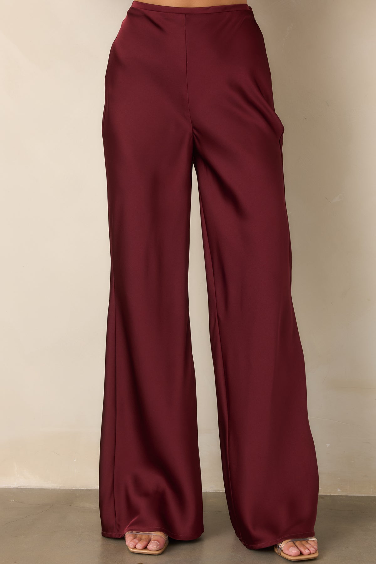 Wide-leg pants showcasing the smooth waistband and long, fluid silhouette.