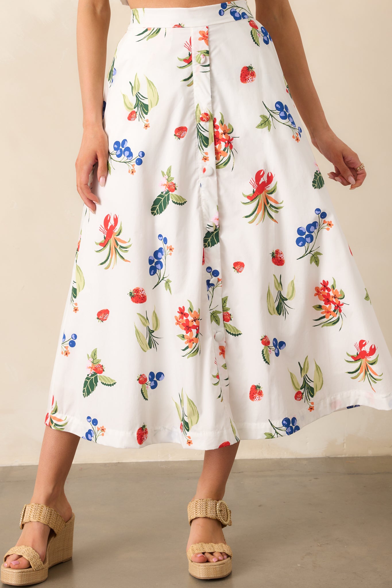 The smooth white fabric of the skirt, accented by a faux button front and functional pockets for practicality.