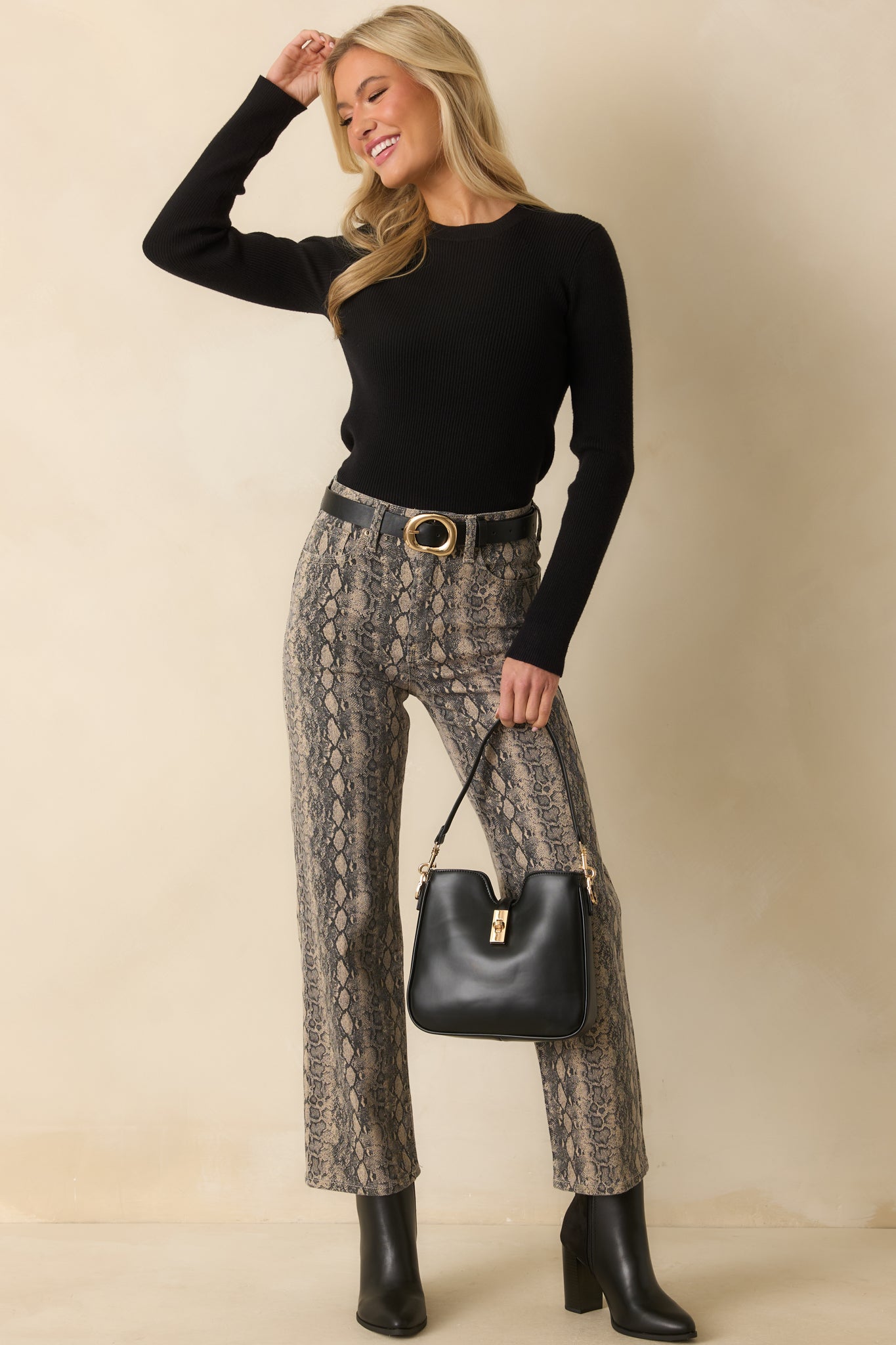 Light stretch cotton denim pants featuring allover snakeskin print and a fitted waist with belt loops.