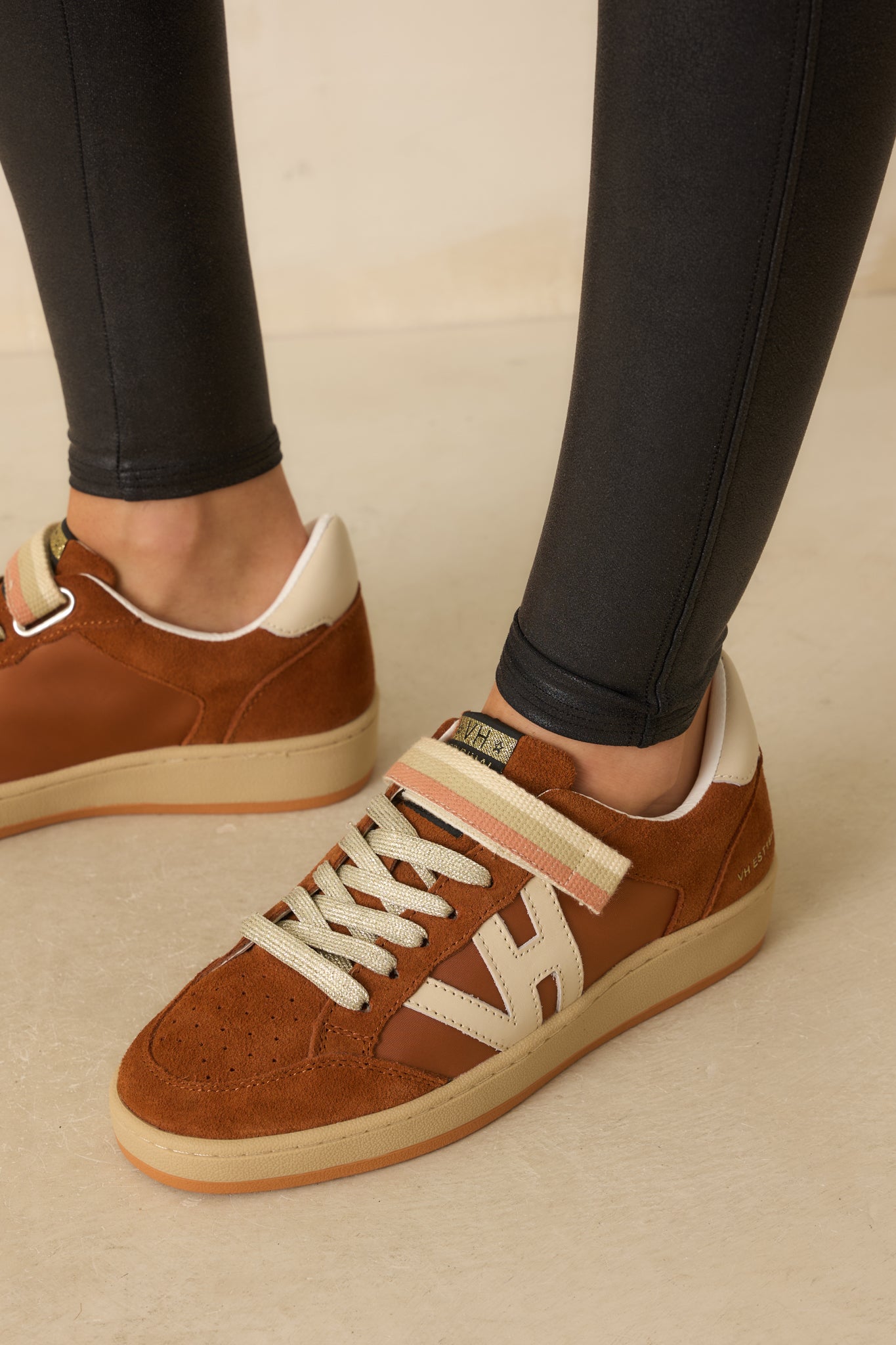 A top-down angle emphasizing toe shape, perforated detailing, and velcro strap placement.