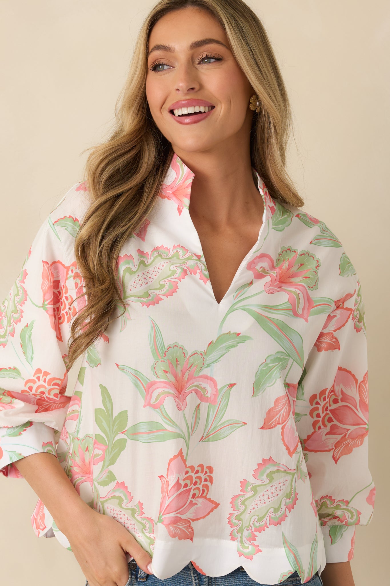 Soft, breathable fabric texture displayed on the relaxed-fit peach top.