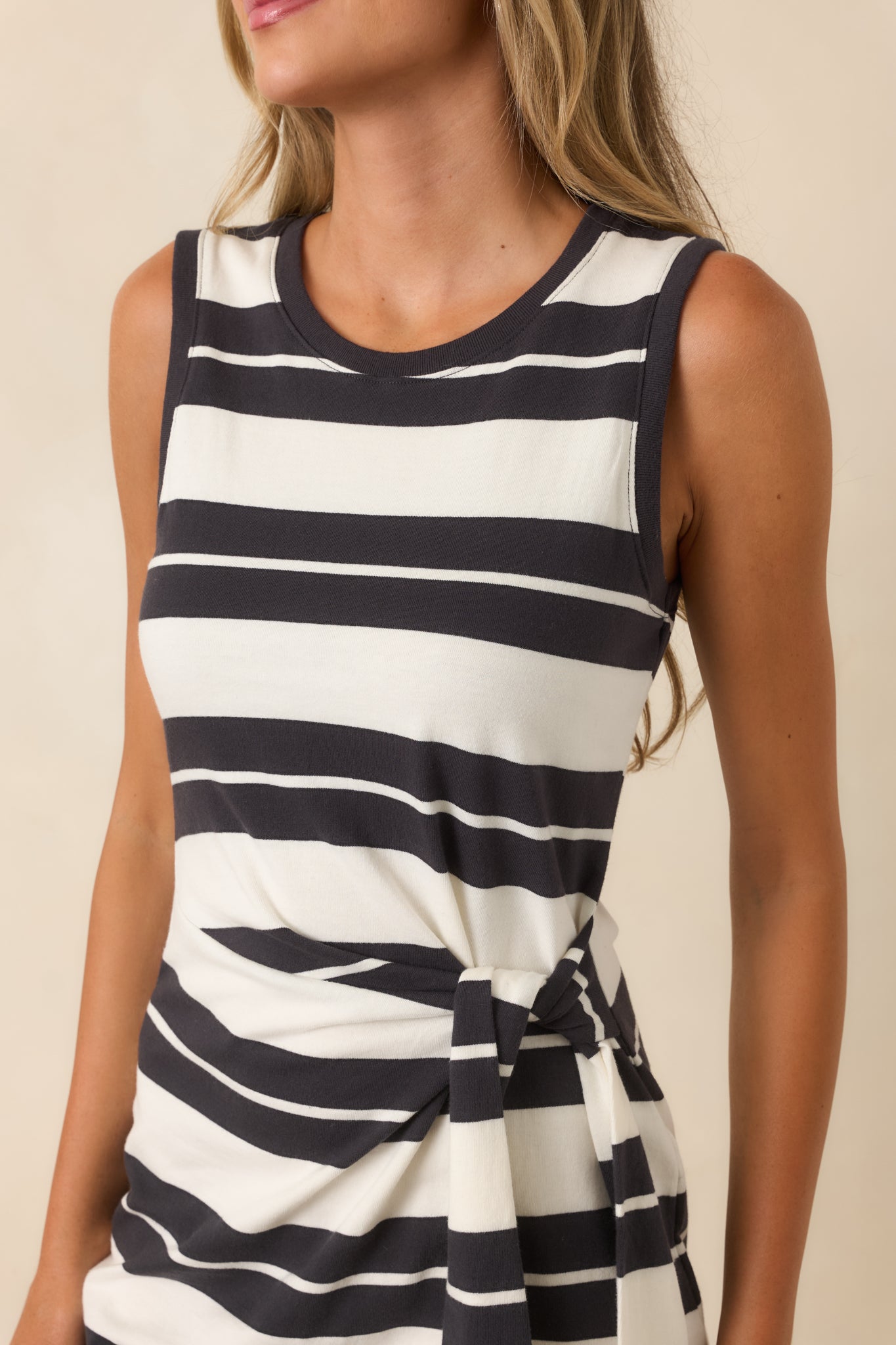 Close-up detail of the soft cotton fabric, striped pattern, and side tie finish.