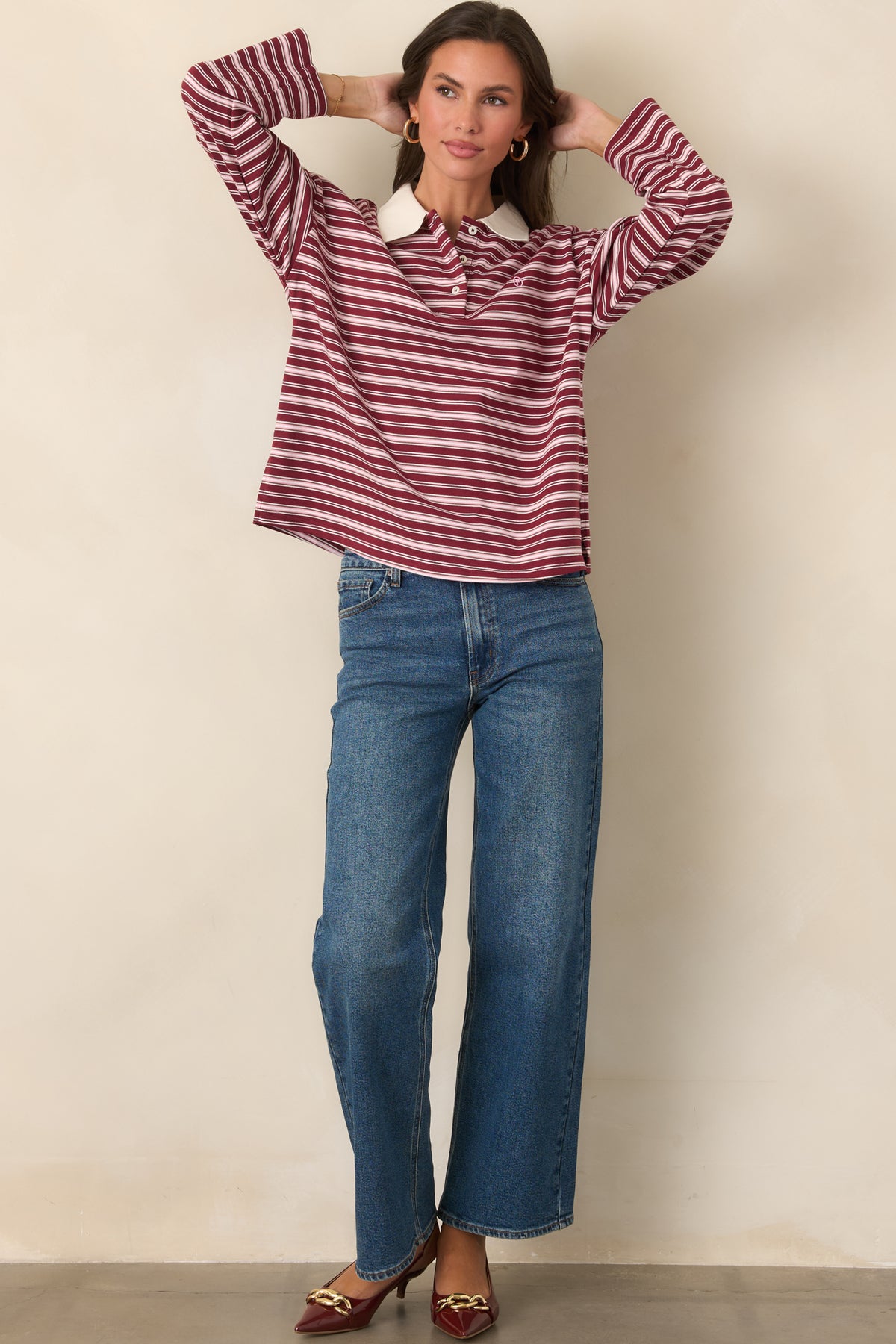 Soft cotton top featuring ivory stripes, a contrasting point collar, partial button placket, dropped shoulders, and a relaxed silhouette.