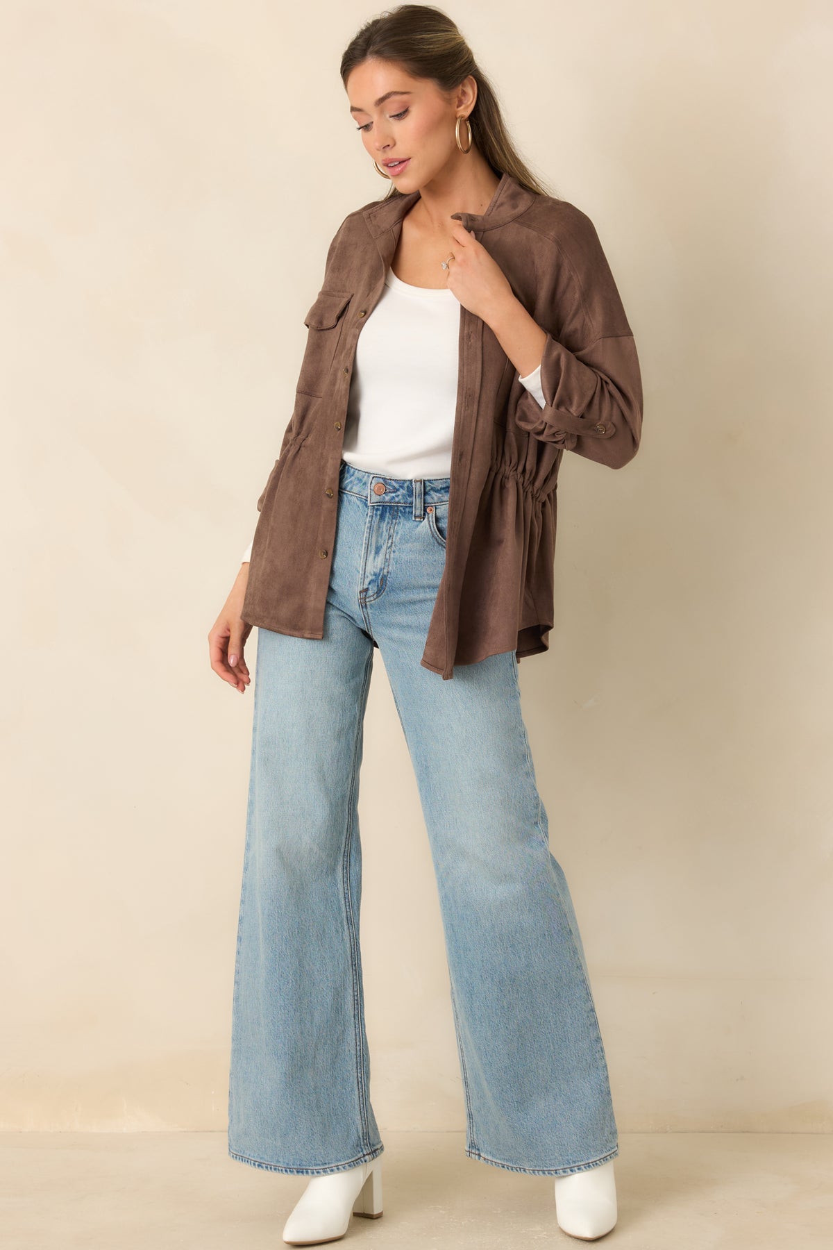 Soft faux suede jacket featuring dropped shoulders, roll-tab sleeves, and a curved hem.