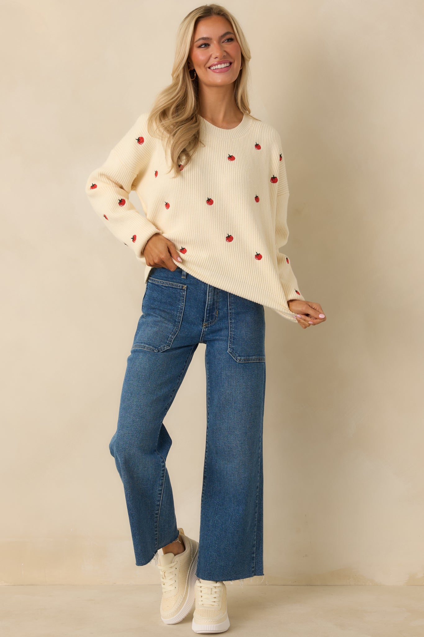 Soft ivory sweater featuring an allover embroidered tomato motif and ribbed trim at neckline, cuffs, and hem.