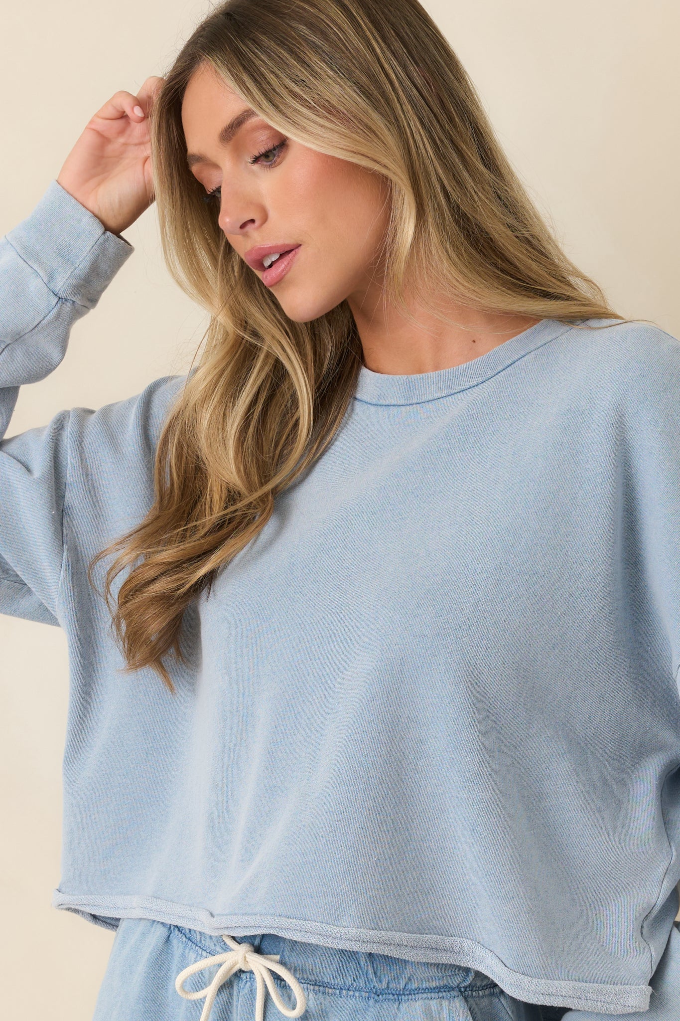 Soft knit pullover featuring a relaxed shape and textured fabric construction.