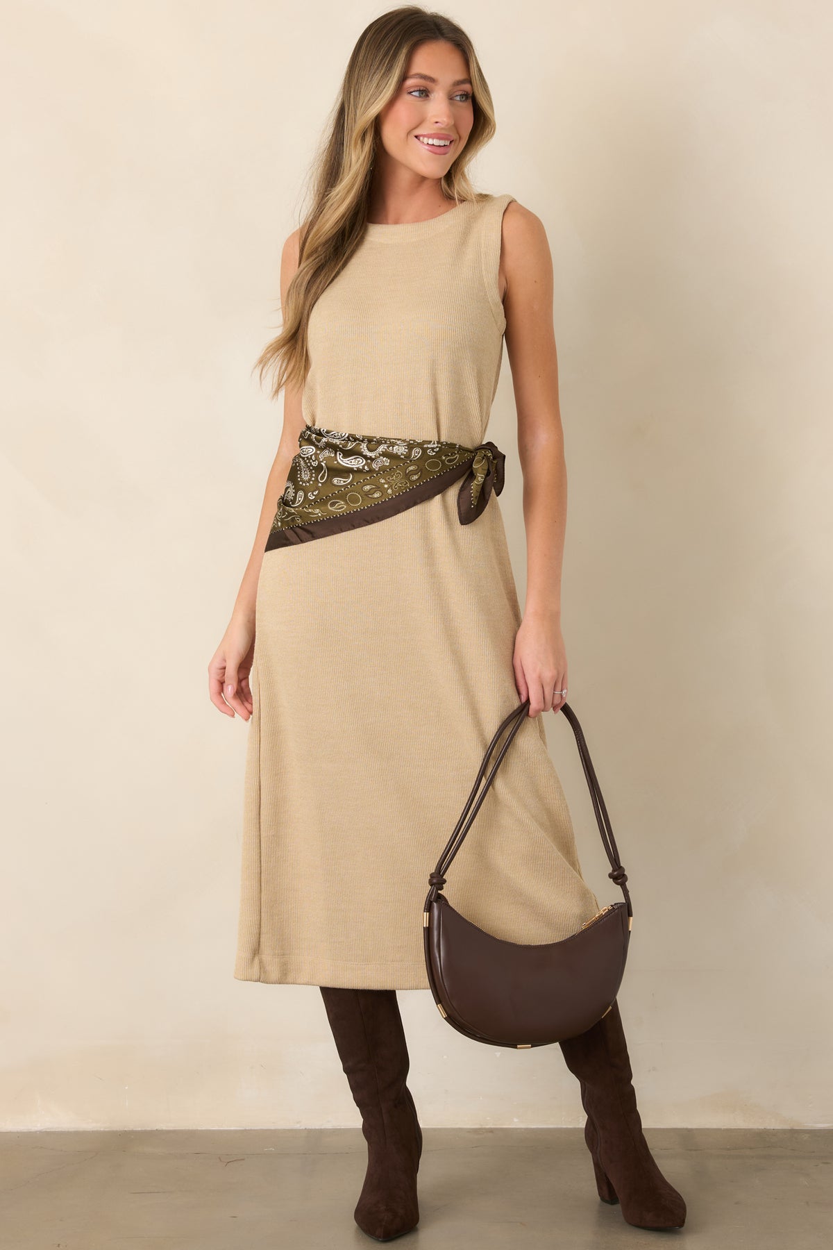 Soft natural midi dress showcasing its sleeveless design, gently rounded neckline, and comfortable ribbed knit construction.