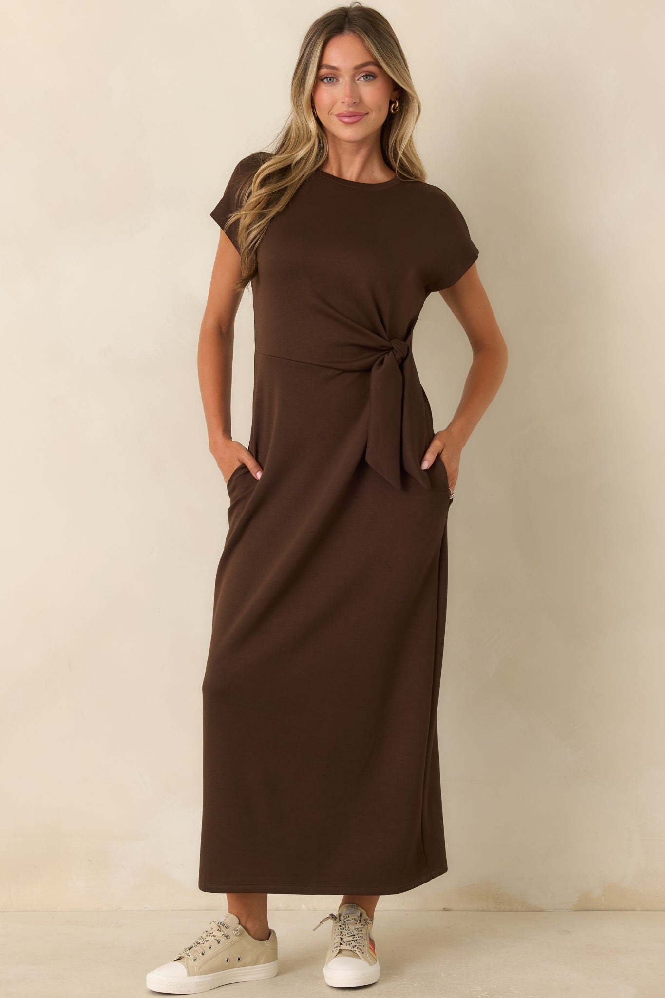 Relaxed yet refined midi dress with a buttery soft texture, flowing drape, and side tie detail.