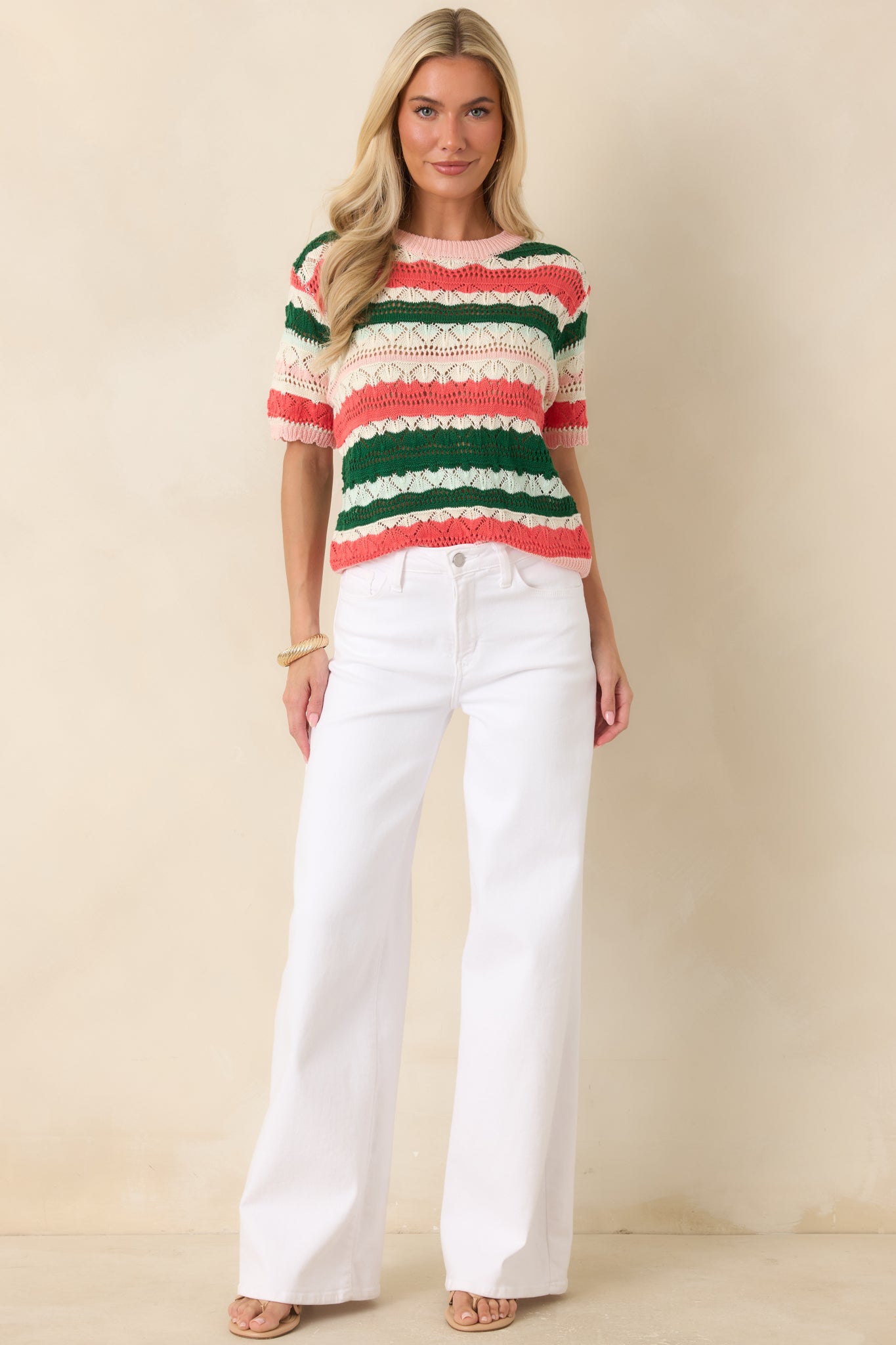Soft striped knit top designed with breathable cotton and viscose fabric, a ribbed crew neckline, short sleeves, and an easy relaxed fit.