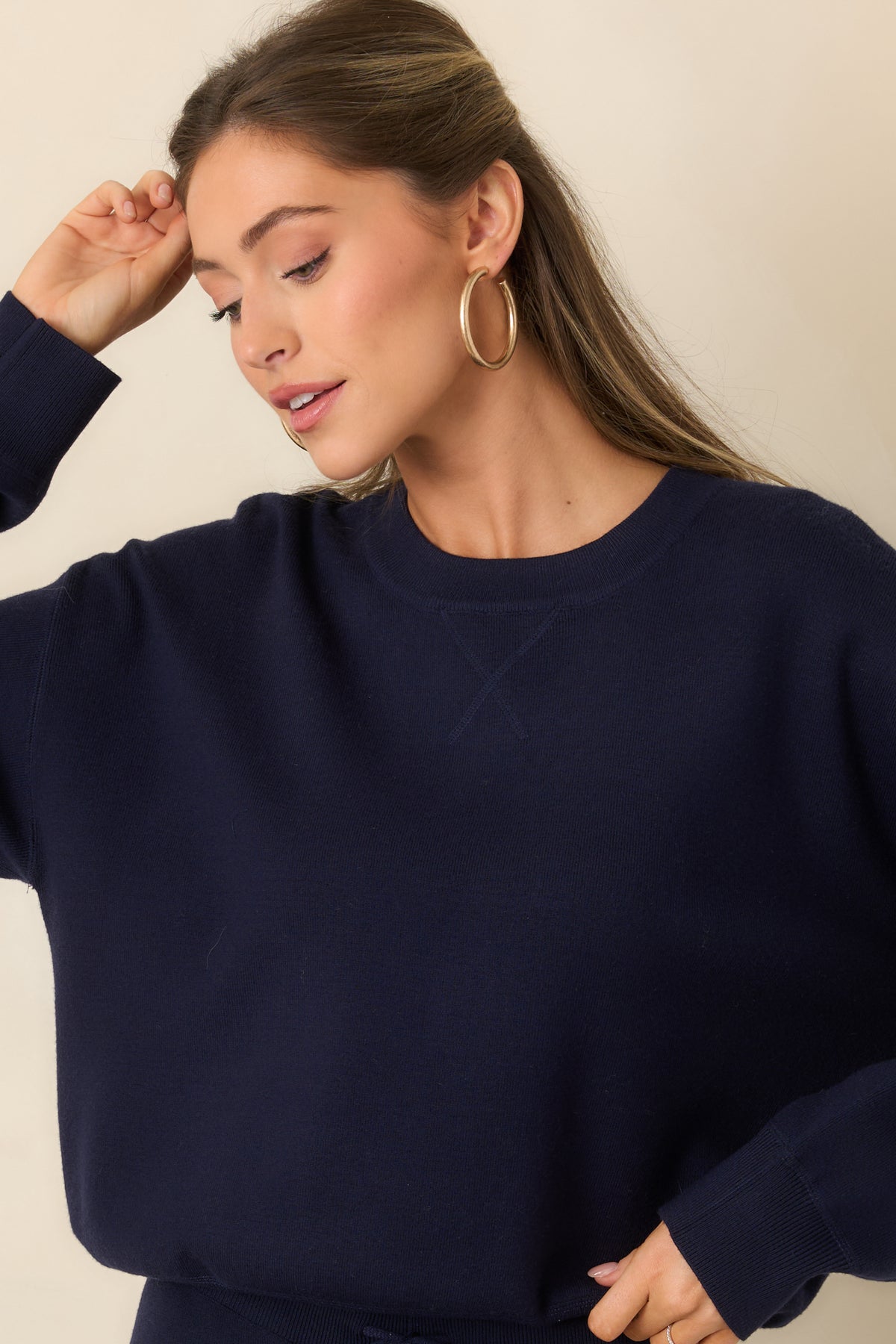 Ribbed cuffs finish the long sleeves of the soft-washed pullover.