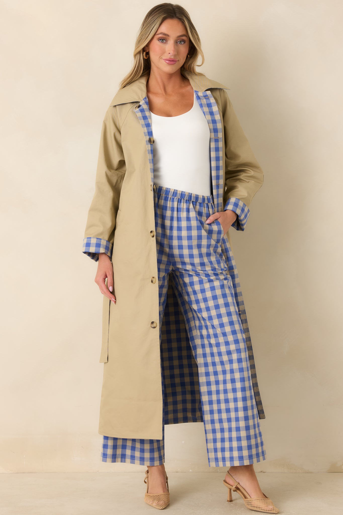 Solid beige side of the reversible cotton coat featuring a contrasting collar, classic button-front styling, and removable self-tie belt.