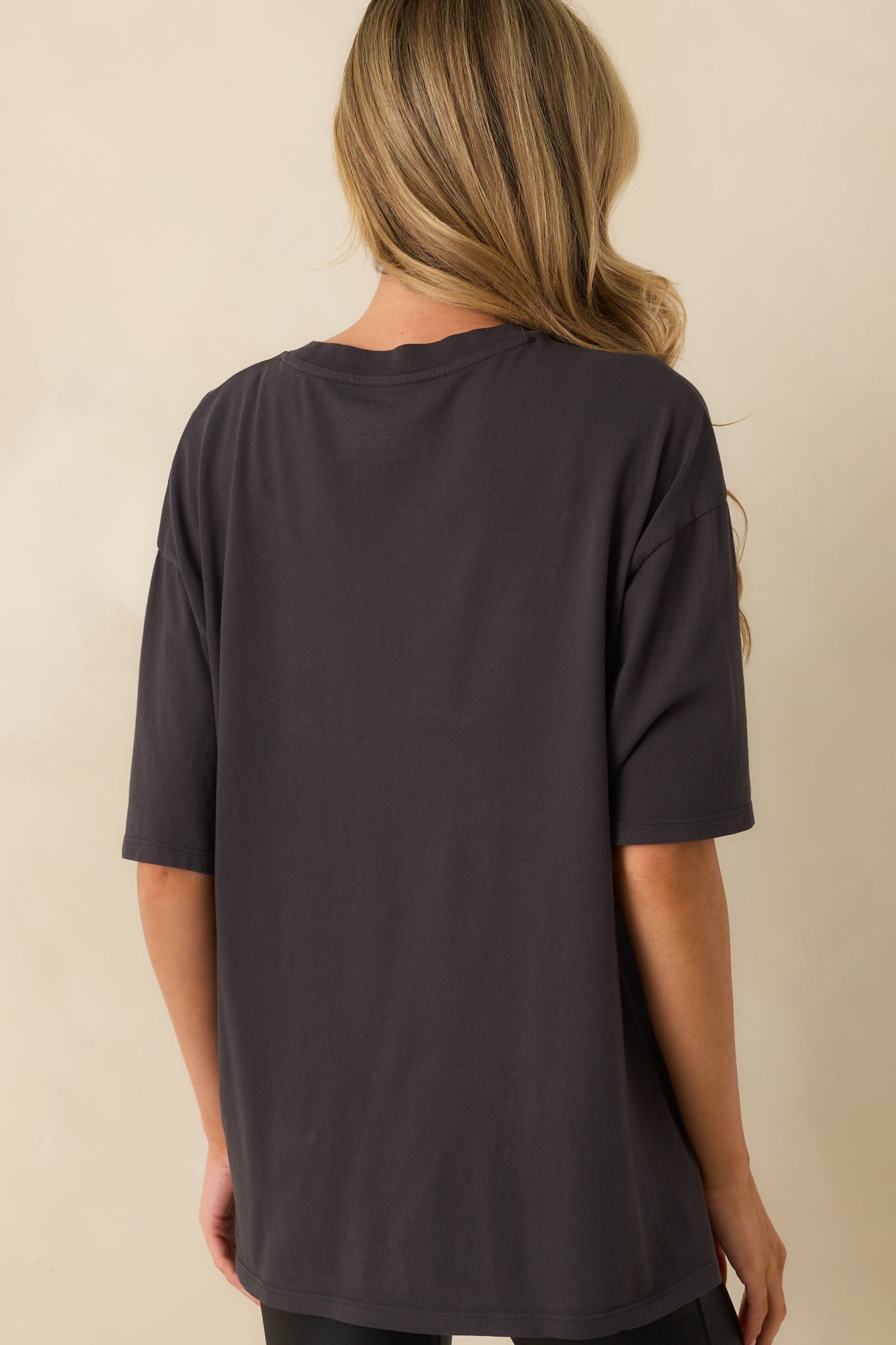 Solid black rear of the short-sleeve tee with a relaxed fit and smooth finish.