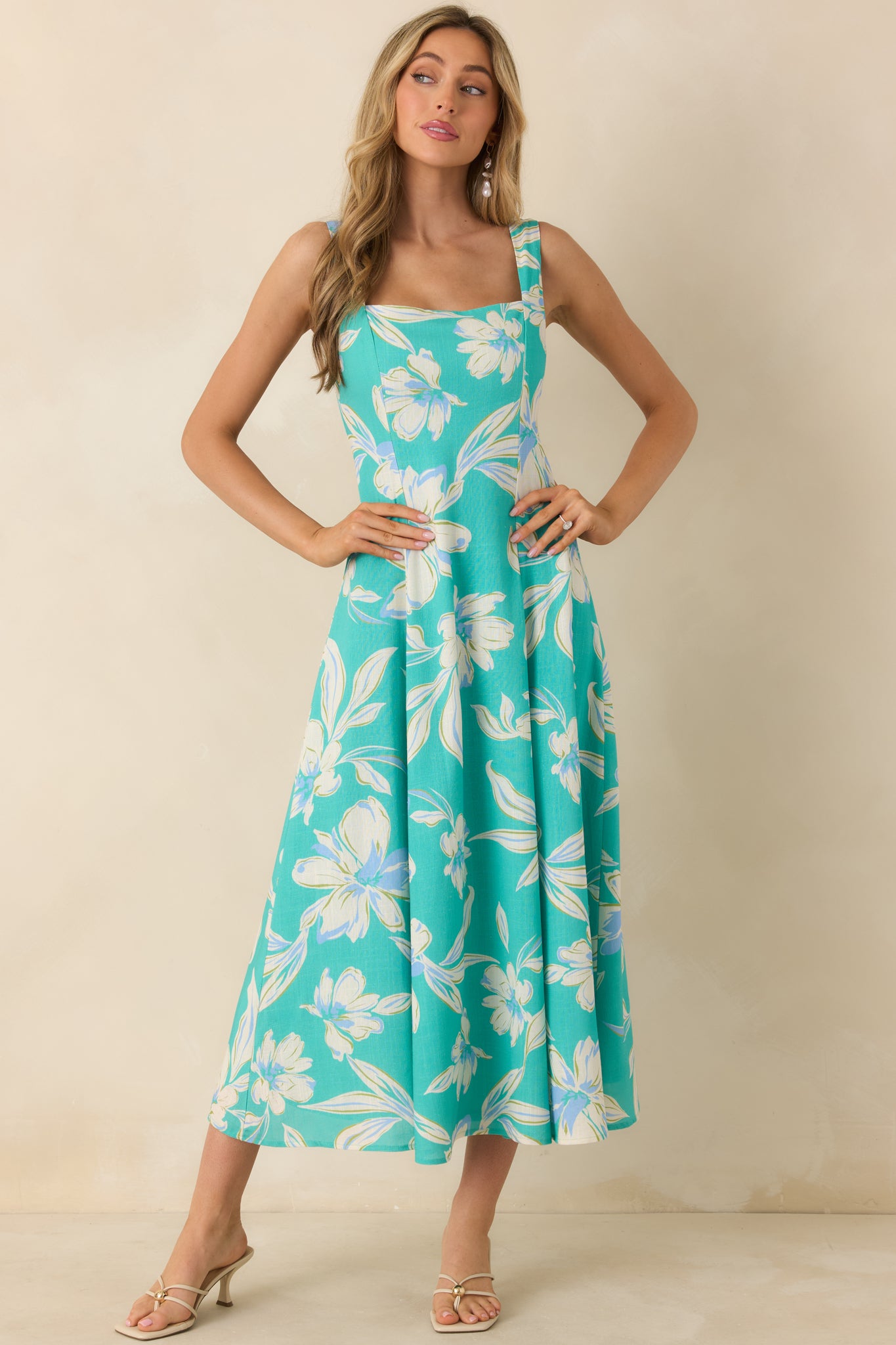 Square neck turquoise dress with wide straps, flattering tailored fit, and gently flared hemline.