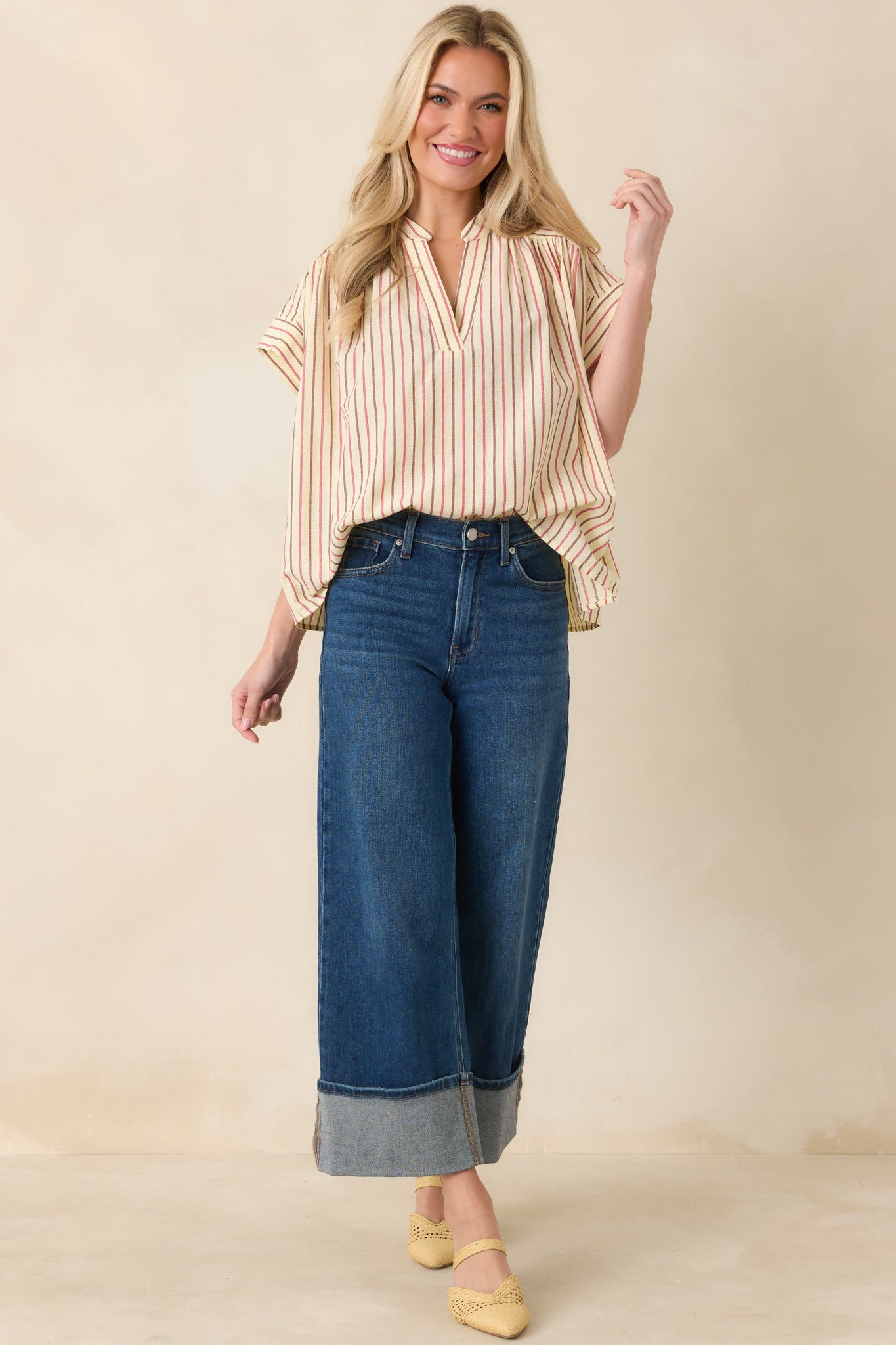 Stand-collar top with V-neck detail and laid-back fit.