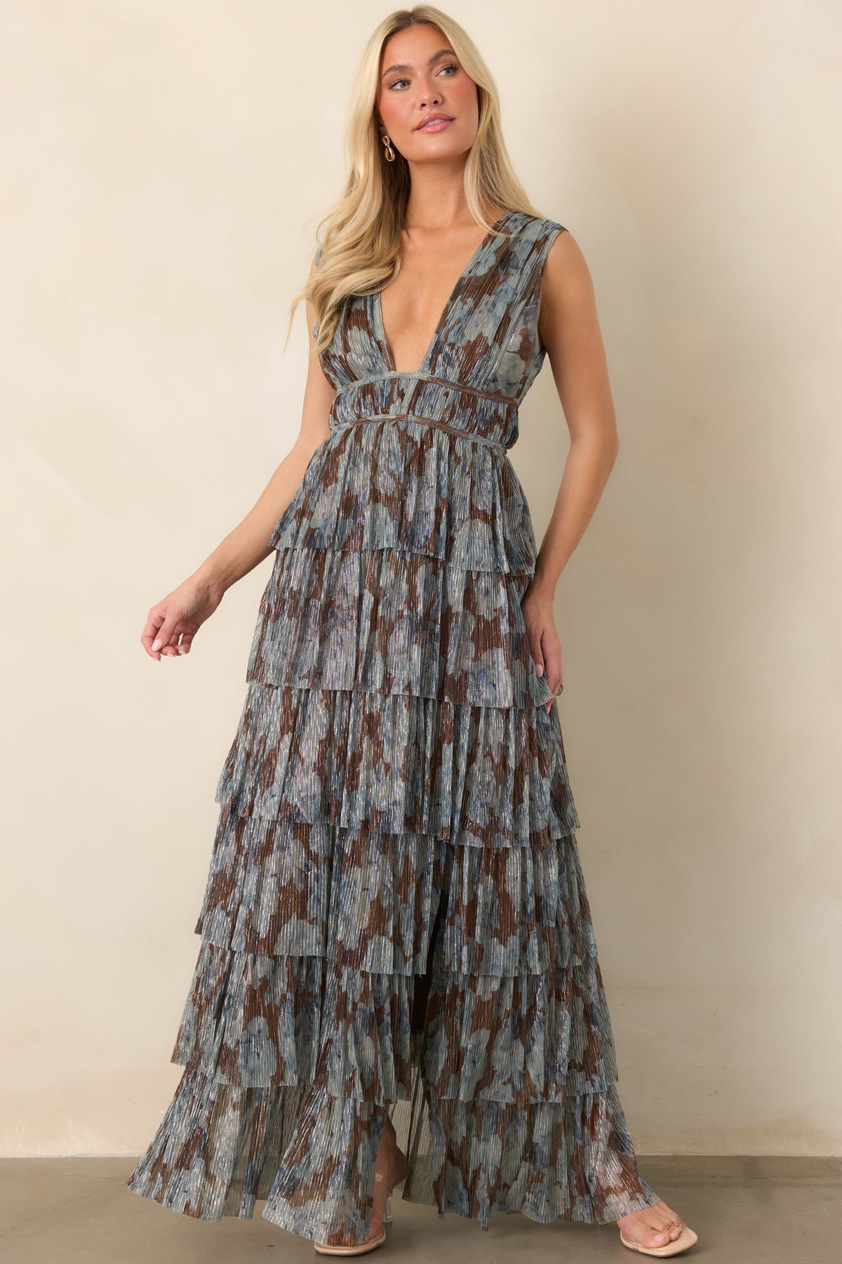 Steel blue and chocolate floral maxi dress featuring shimmery plissé fabric and a full tiered skirt.
