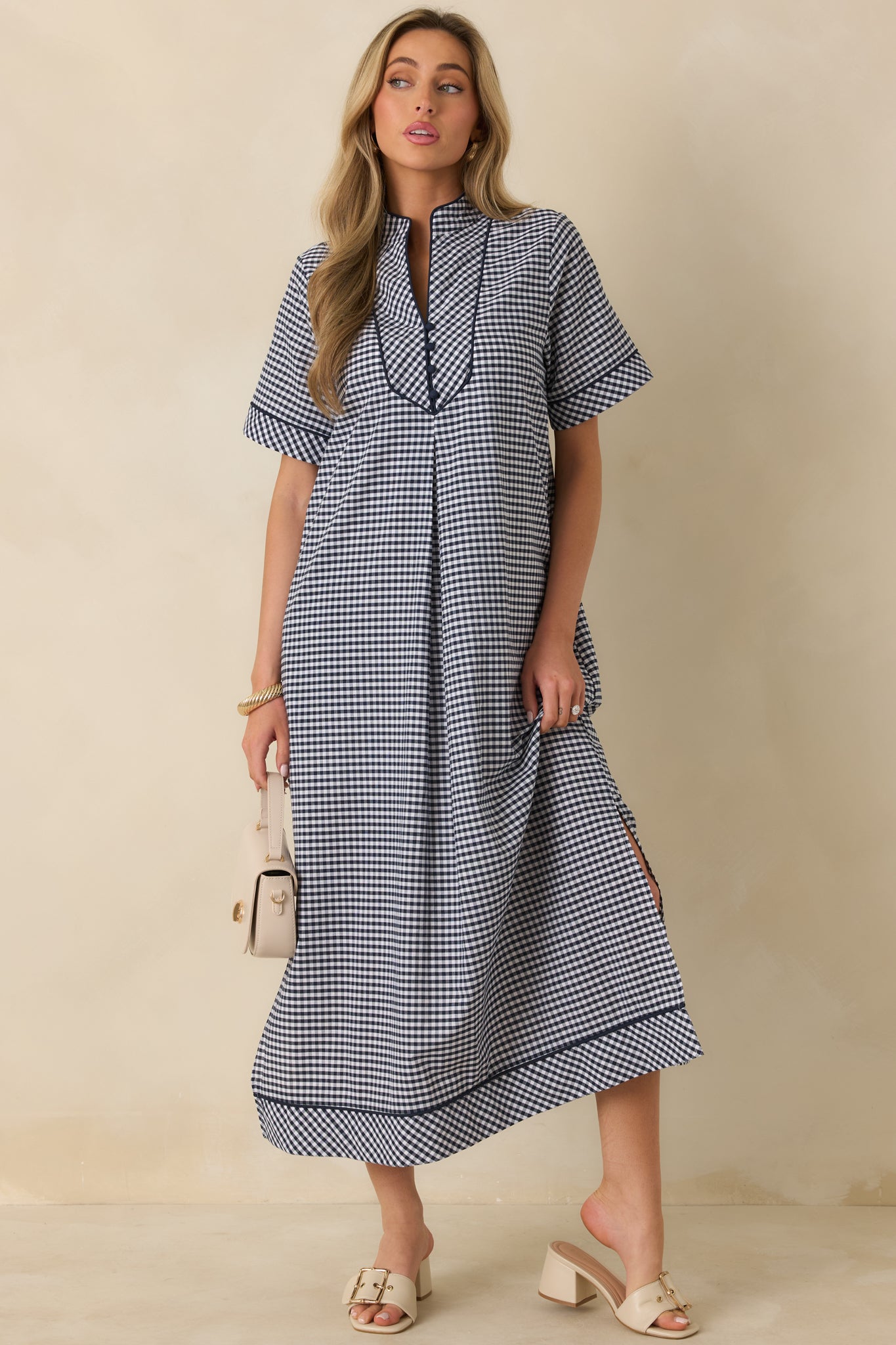 Straight-on front angle highlighting the gingham pattern, V-neck contrast trim, and easy, flowing maxi length.