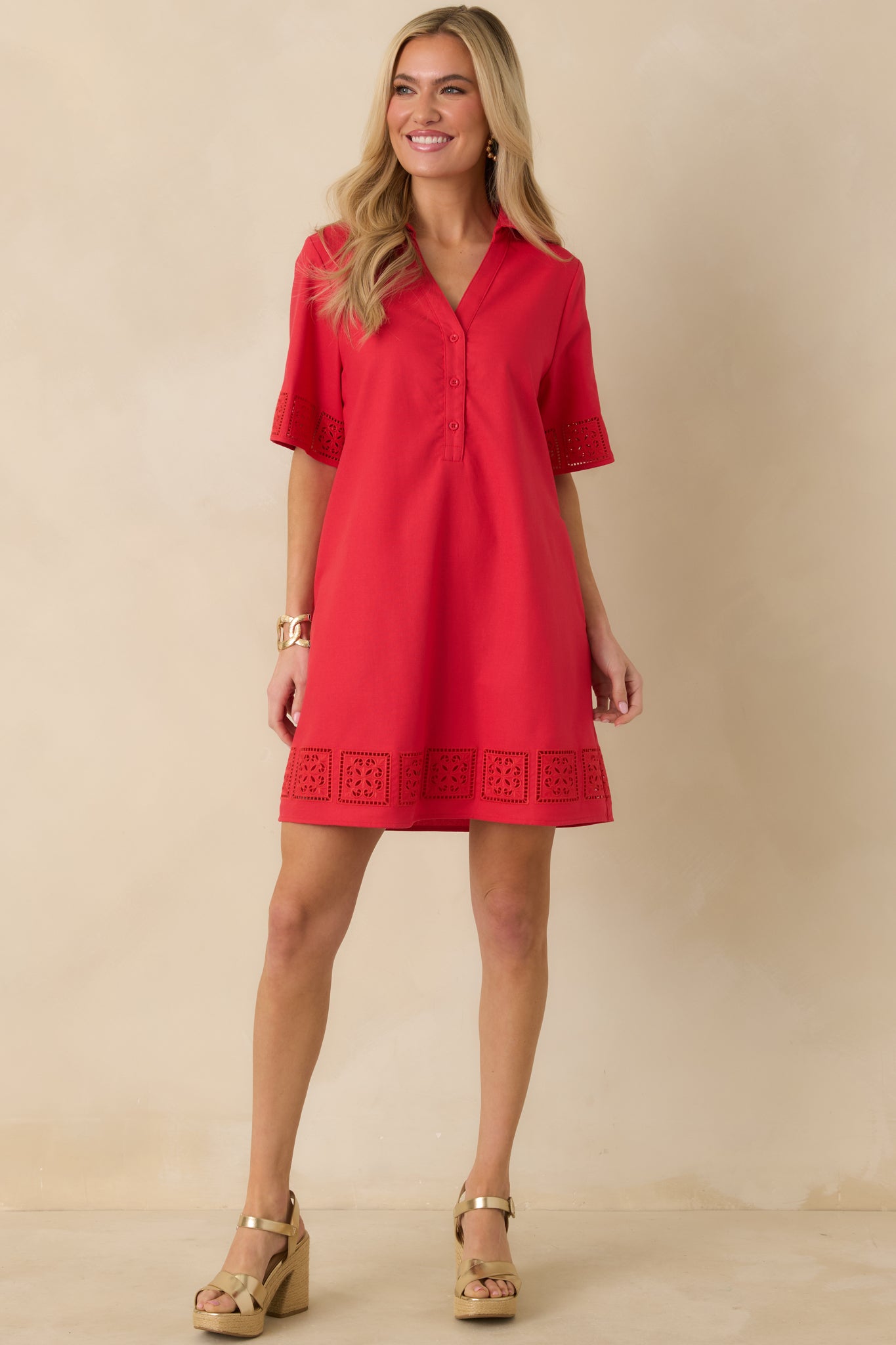 Straight-on front angle showing the smooth cotton-blend fabric, mini-length hemline, and polished silhouette of the red dress.