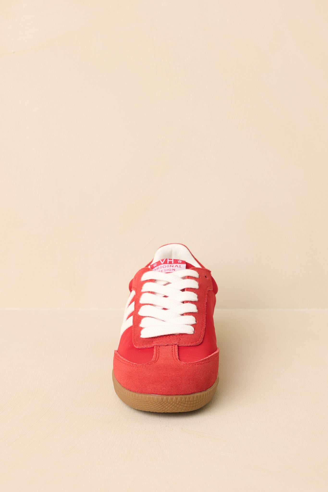 Straight shot showcasing pearl bow detail and mixed material upper.