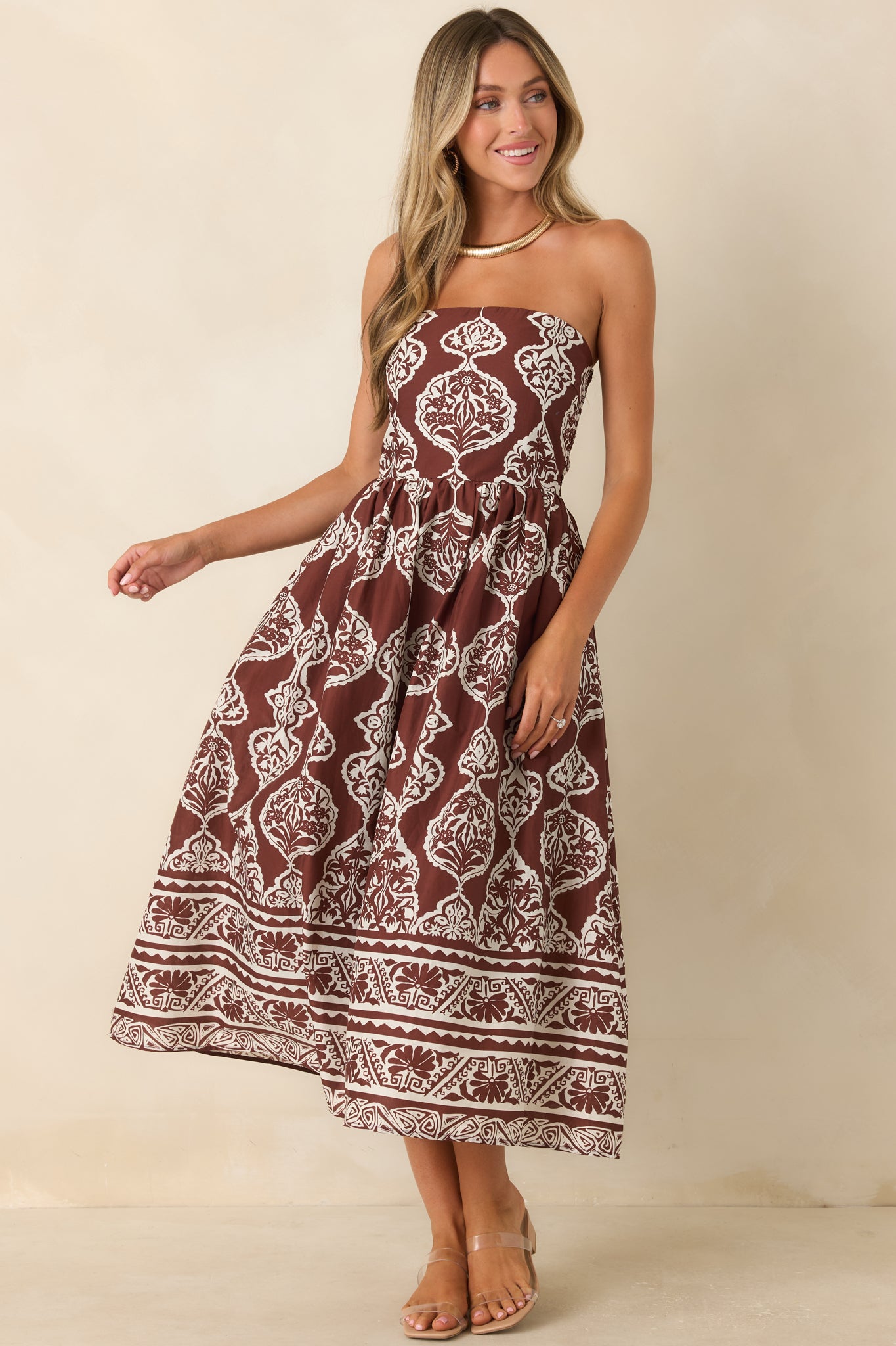 Strapless cotton midi dress showcasing a detailed medallion pattern, flattering fitted bodice, and flowing gathered skirt.