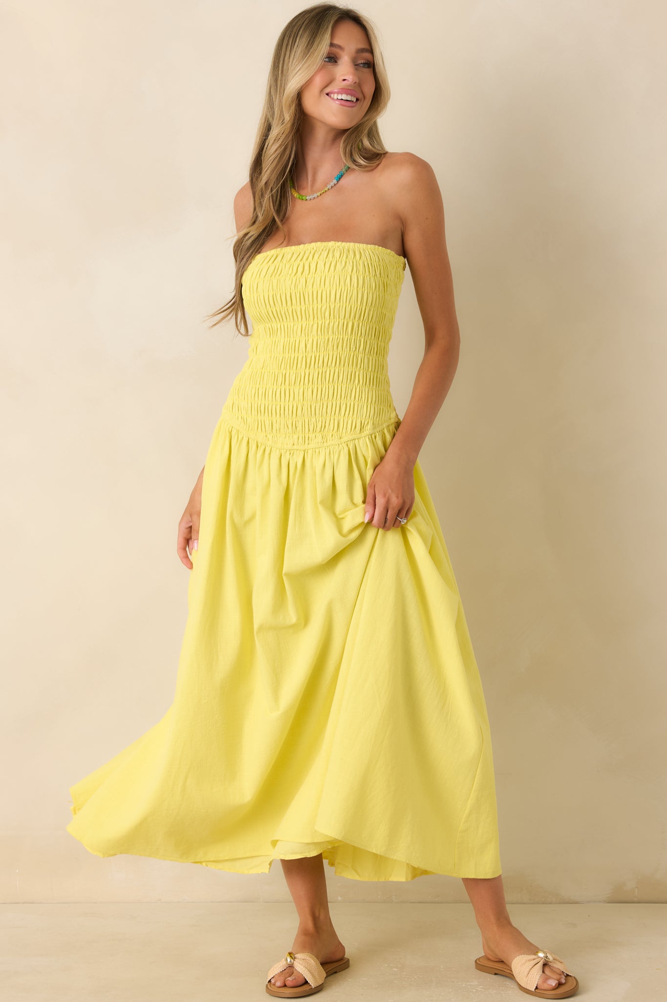 Strapless yellow maxi dress with a rayon-lined skirt, soft cotton fabric, and an easy, comfortable pull-on fit.
