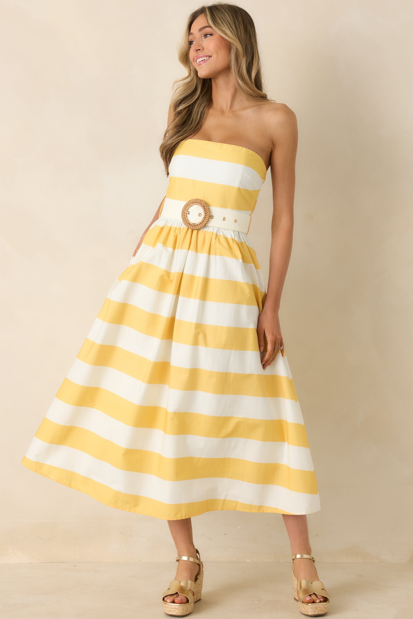 Strapless midi dress with bold, eye-catching stripes and structured bodice.