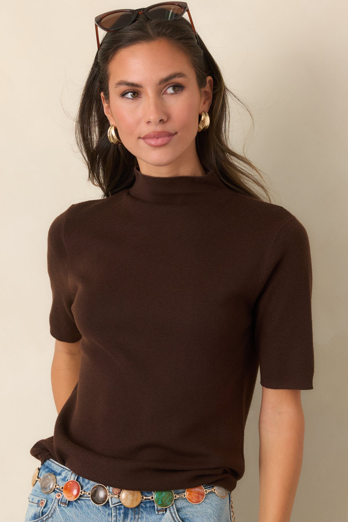 Streamlined top showcasing the smooth knit construction and tall neckline.
