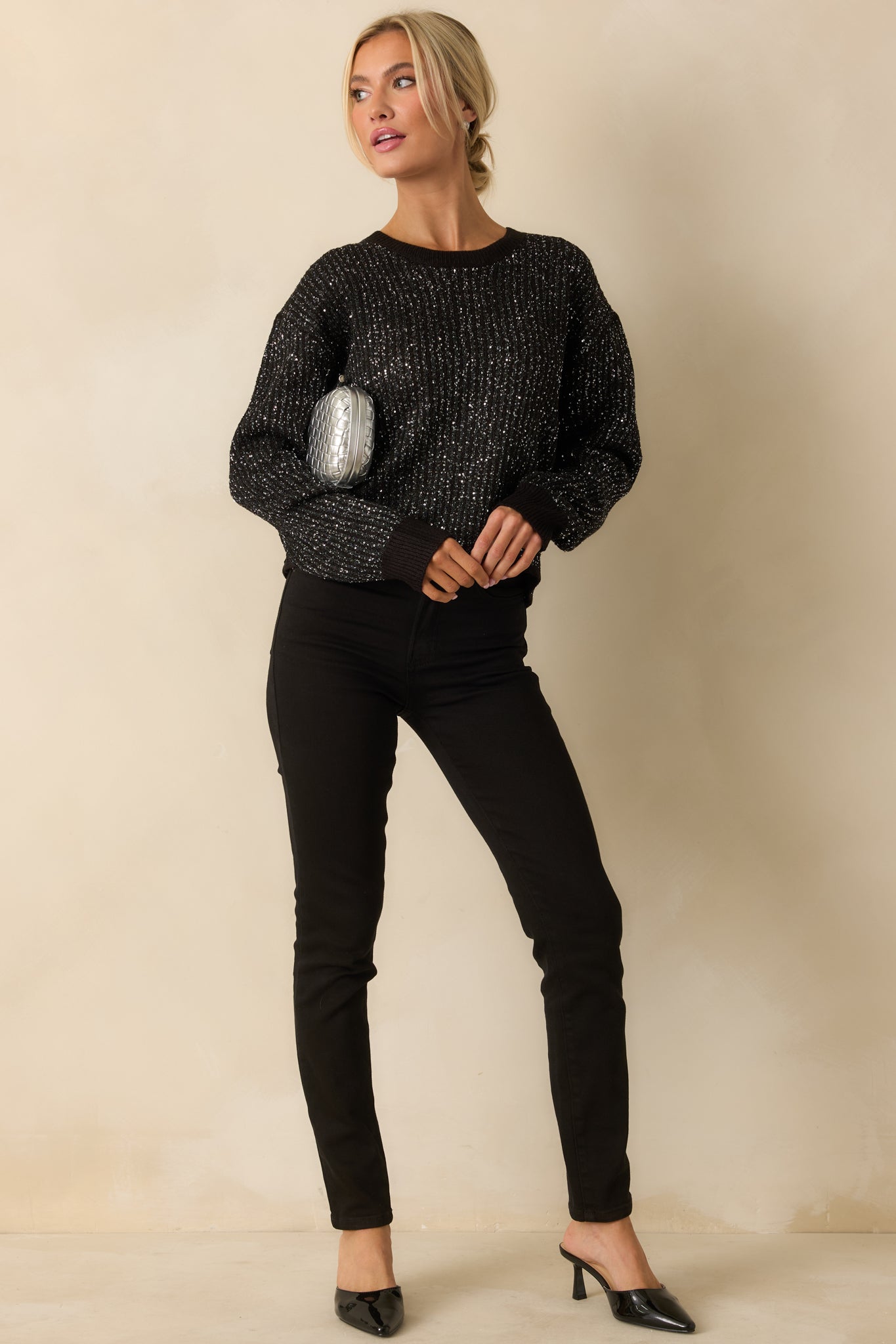 Stretch black jeans featuring a high-rise waist and a polished, all-day wear finish.