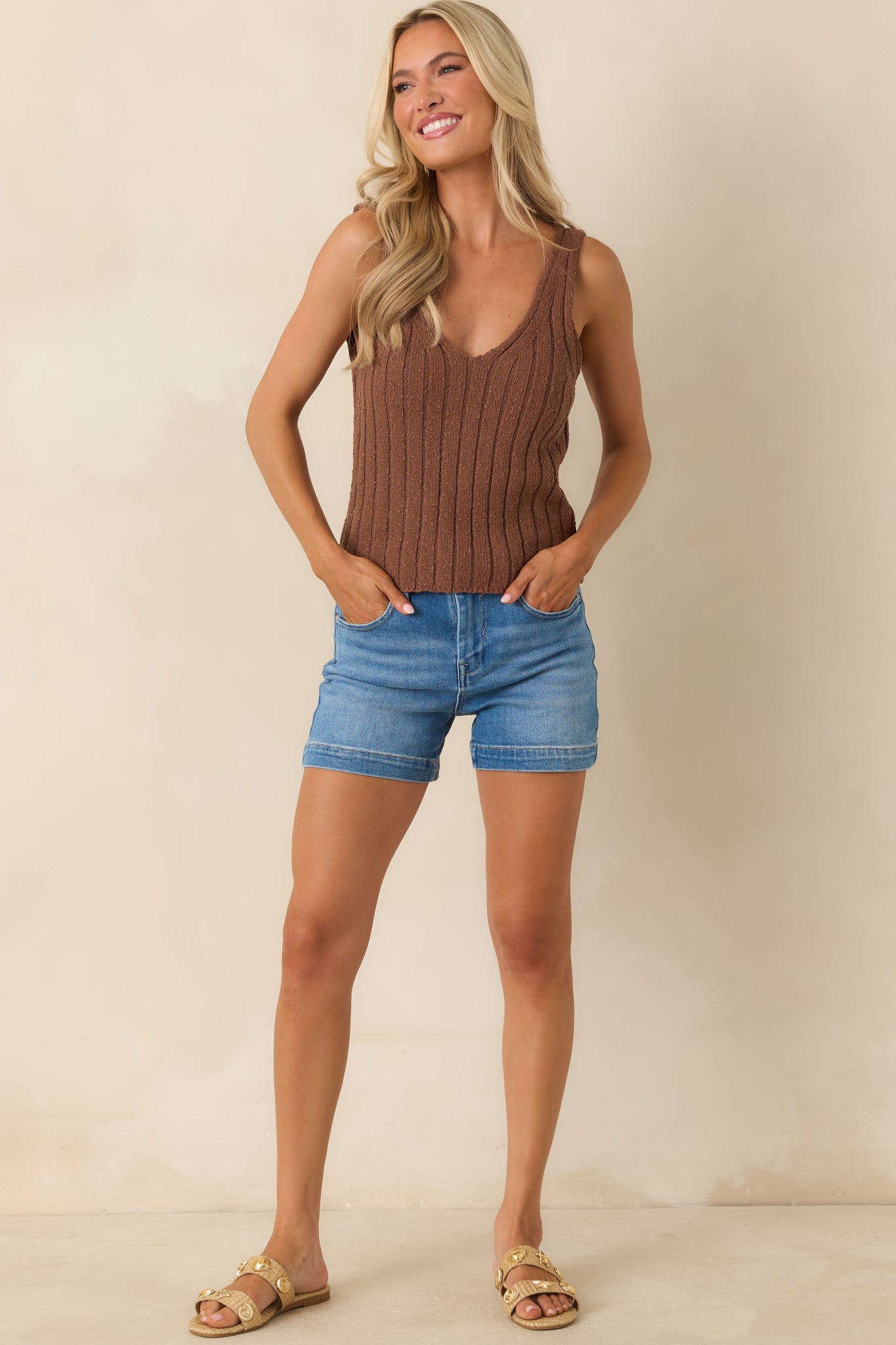 Stretch denim shorts showcasing a mid-rise fit, belt loops, and an easy everyday silhouette in a versatile medium wash.