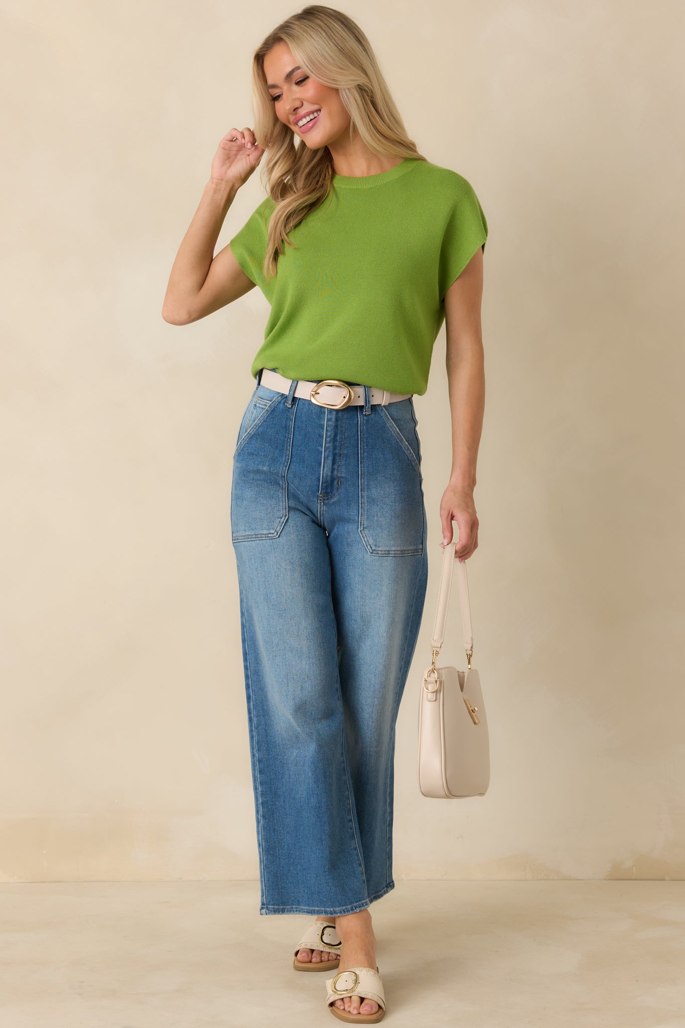 Comfortable stretch knit top with relaxed sleeves and simple crew neckline.