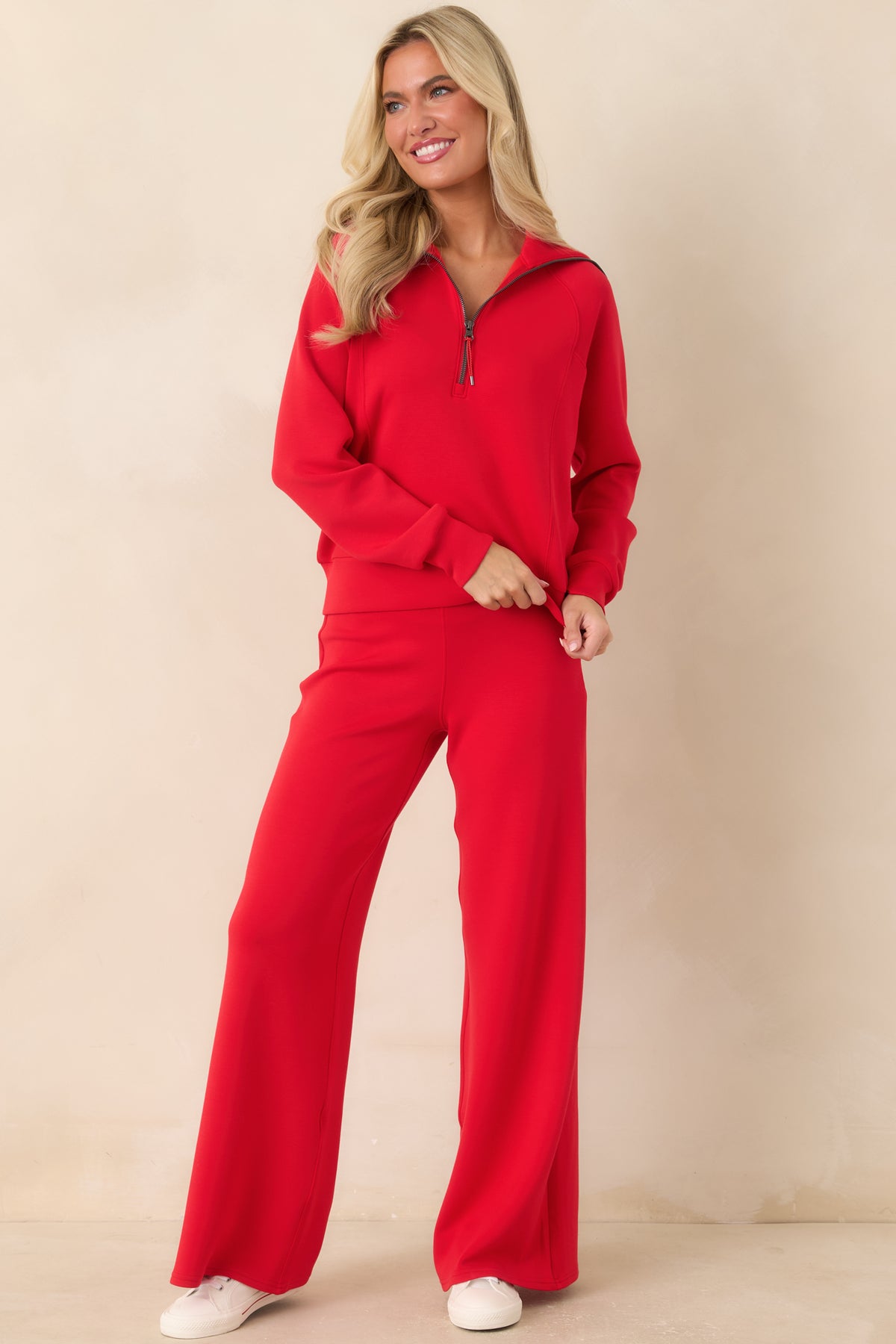 Four-way stretch red pants featuring a pull-on design, relaxed silhouette, streamlined seams, and elegant wide-leg drape.