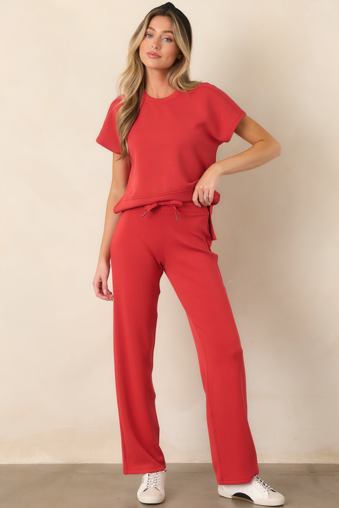 Comfortable stretch top showcasing a relaxed silhouette, clean crew neckline, short sleeves, and side-slit hem.