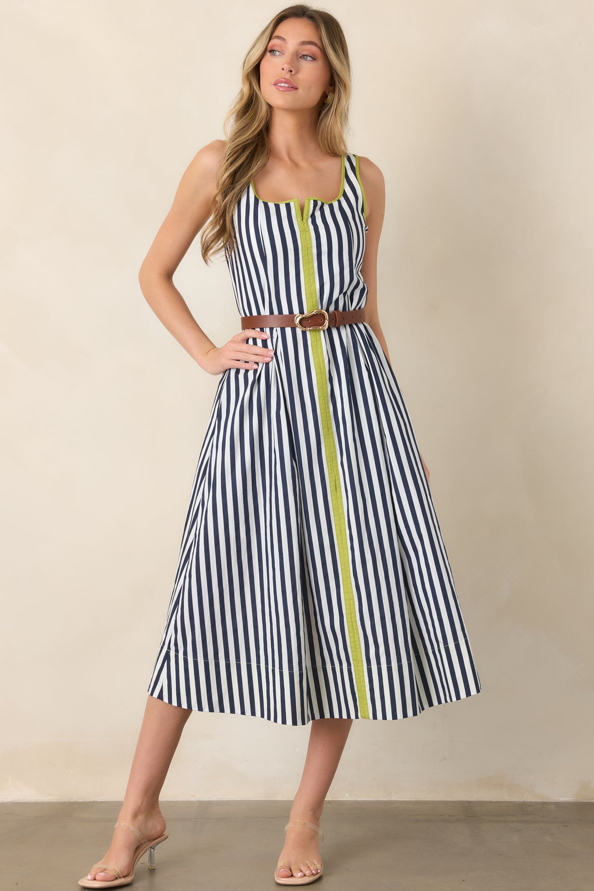 Striped cotton midi dress combining classic navy and ivory coloring with playful chartreuse borders and a comfortably flowing skirt.